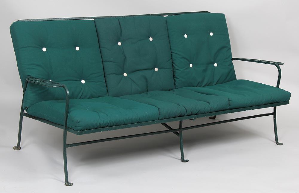 Salterini wrought iron patio settee: Salterini wrought iron patio settee with ivy decoration, fold down backrest, includes cushions. 31-3/4''h, 70-1/4''w, 33''d