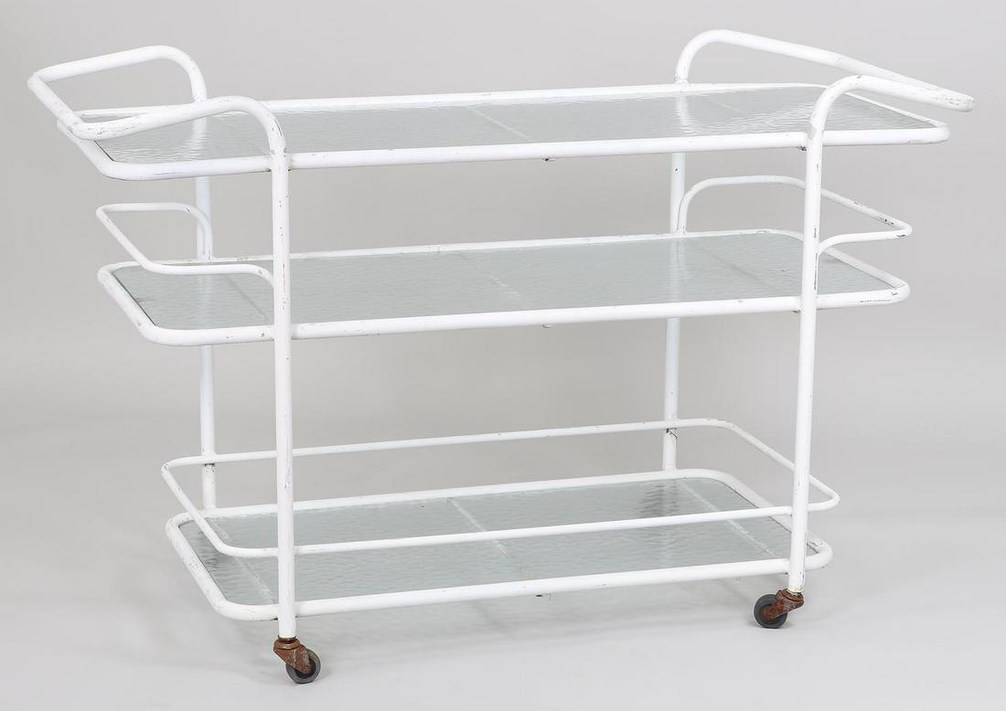 Tubular rolling bar cart, attributed to Brown Jordan: Tubular rolling bar cart, attributed to Brown Jordan, having three glass shelves, painted white. Handles bent, wheels need resetting. 33''h, 52''w, 21-1/2''d.