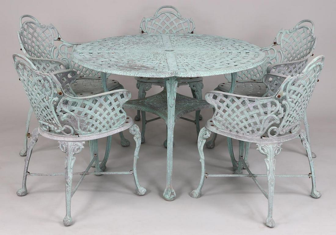 Six piece aluminum patio dining set: Six piece aluminum patio dining set with basket weave design and ball and claw feet, in pale blue, to include: a round table; and (5) arm chairs. Weathered. Table 27-1/2''h, 41-1/2''dia.