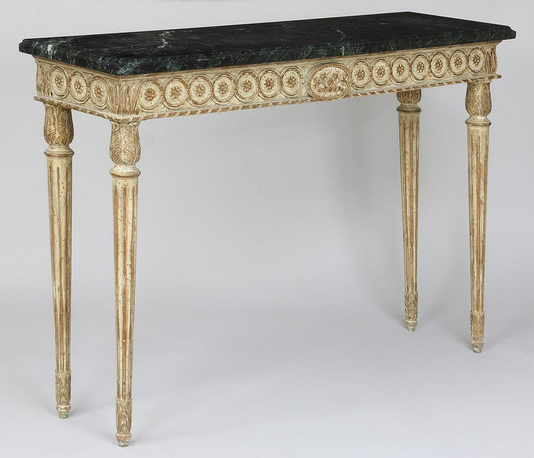Continental carved marble top console table: Continental carved marble top console table in fashionably distressed white with gilding, floral decoration, and tapering fluted legs, 20th century. 36-1/4''h, 52''w, 15''d.