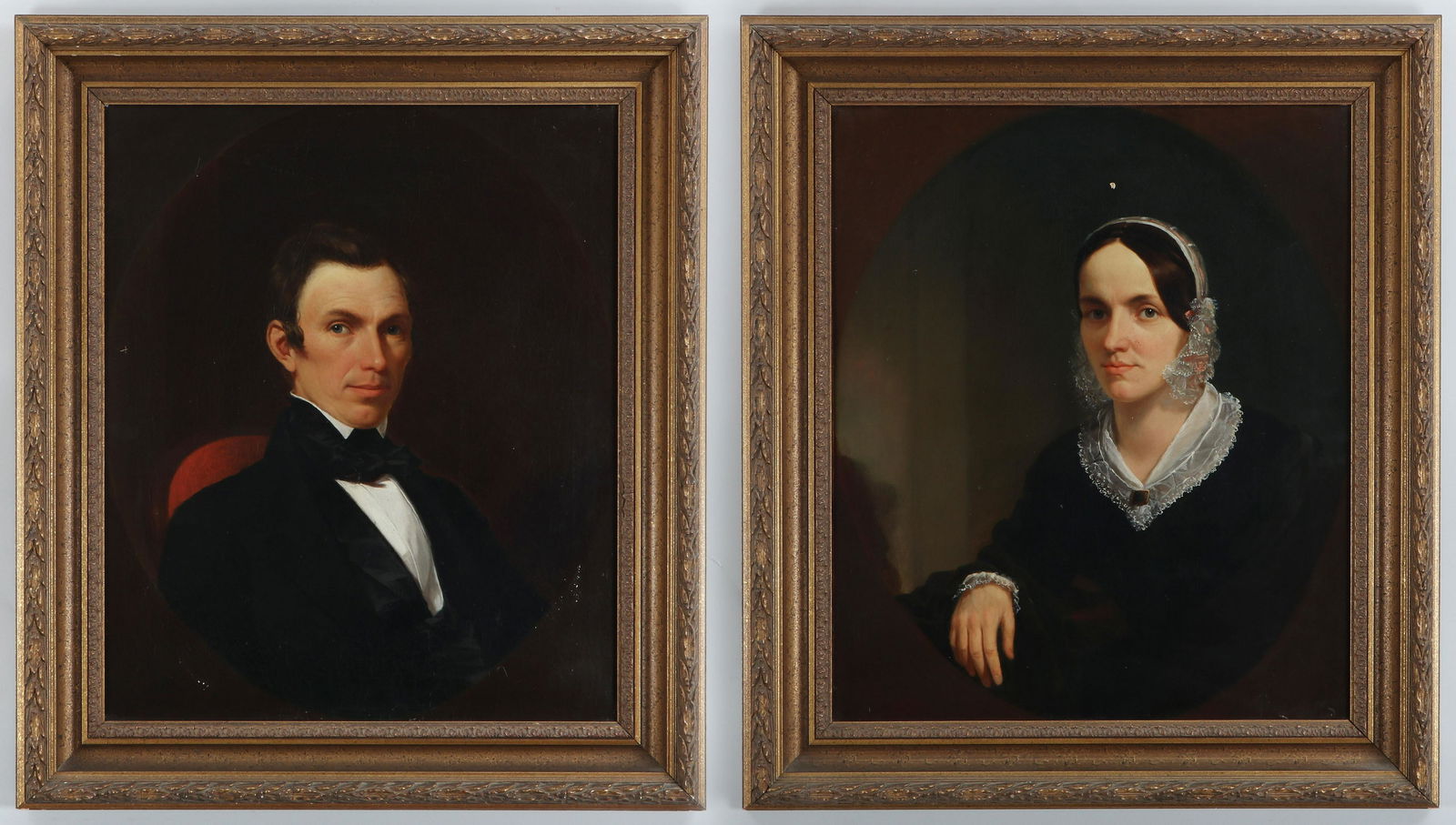 Pair of 19th century portraits: Pair of portraits depicting gentleman and lady in lace (British School, 19th century), oil on canvas, unsigned. Craquelure, relined, scattered inpaint, dirt and grime. Each canvas 30''h, 25''w.