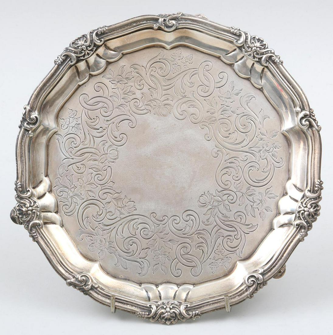 Small 19th century English sterling silver round salver: Small 19th century English sterling silver round salver with incised foliate design on three feet, hallmarked for Robert Garrard II, London, 1849. 1''h, 8-1/2''dia. Total approximate weight 16.0 troy