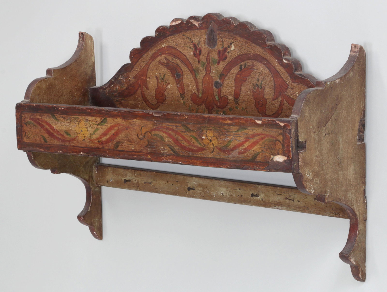 Painted hanging wall shelf: Painted hanging wall shelf with foliate decoration. Losses to paint and wood. 15-1/2''h, 23-3/4''w, 6-3/4''d.