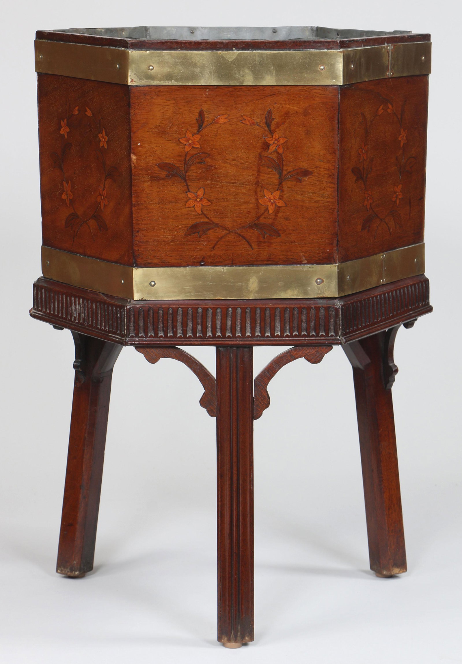 Georgian octagonal cellarette: Georgian octagonal cellarette with floral inlay decoration and brass bands, fitted with zinc liner for use as planter. Wear and small repairs, no top. 25-3/4''h, 17-3/4''w, 15-1/4''d.
