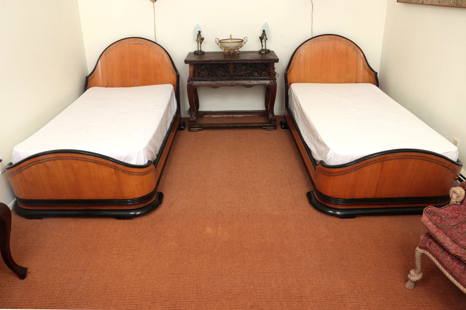 Pair of Biedermeier beds: Pair of Biedermeier beds having curved headboards and footboards, with ebonized trim and brass line inlay. Wear from use, lifting and loss to inlay and veneer. 38-3/4''h, 89-1/2''w, 44-3/4''d; fits tw