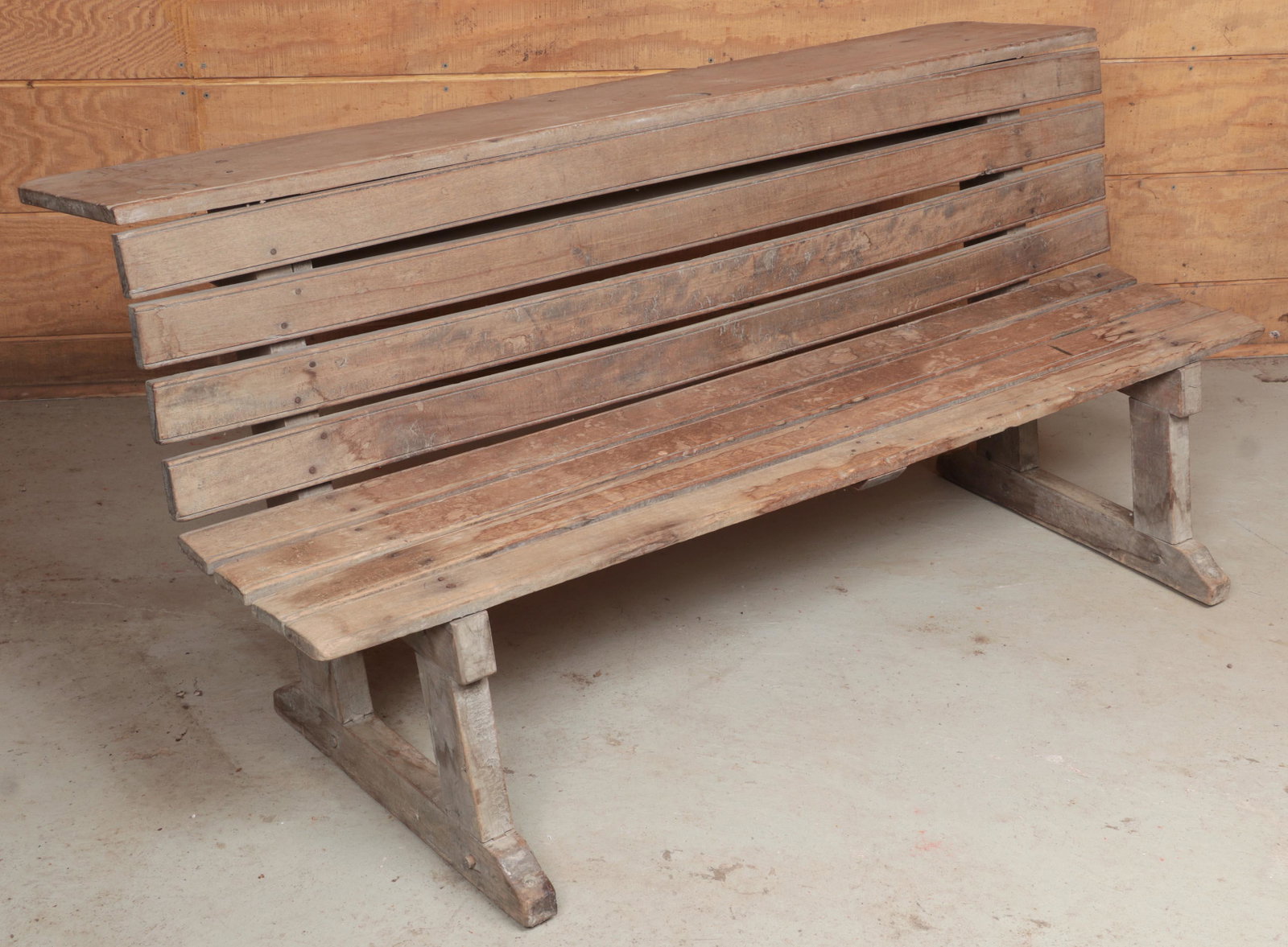 Wood school bench: Wood school bench with slat seat and writing surface and book shelf behind backrest. 27-1/4''h, 60''w, 30-3/4''d.
