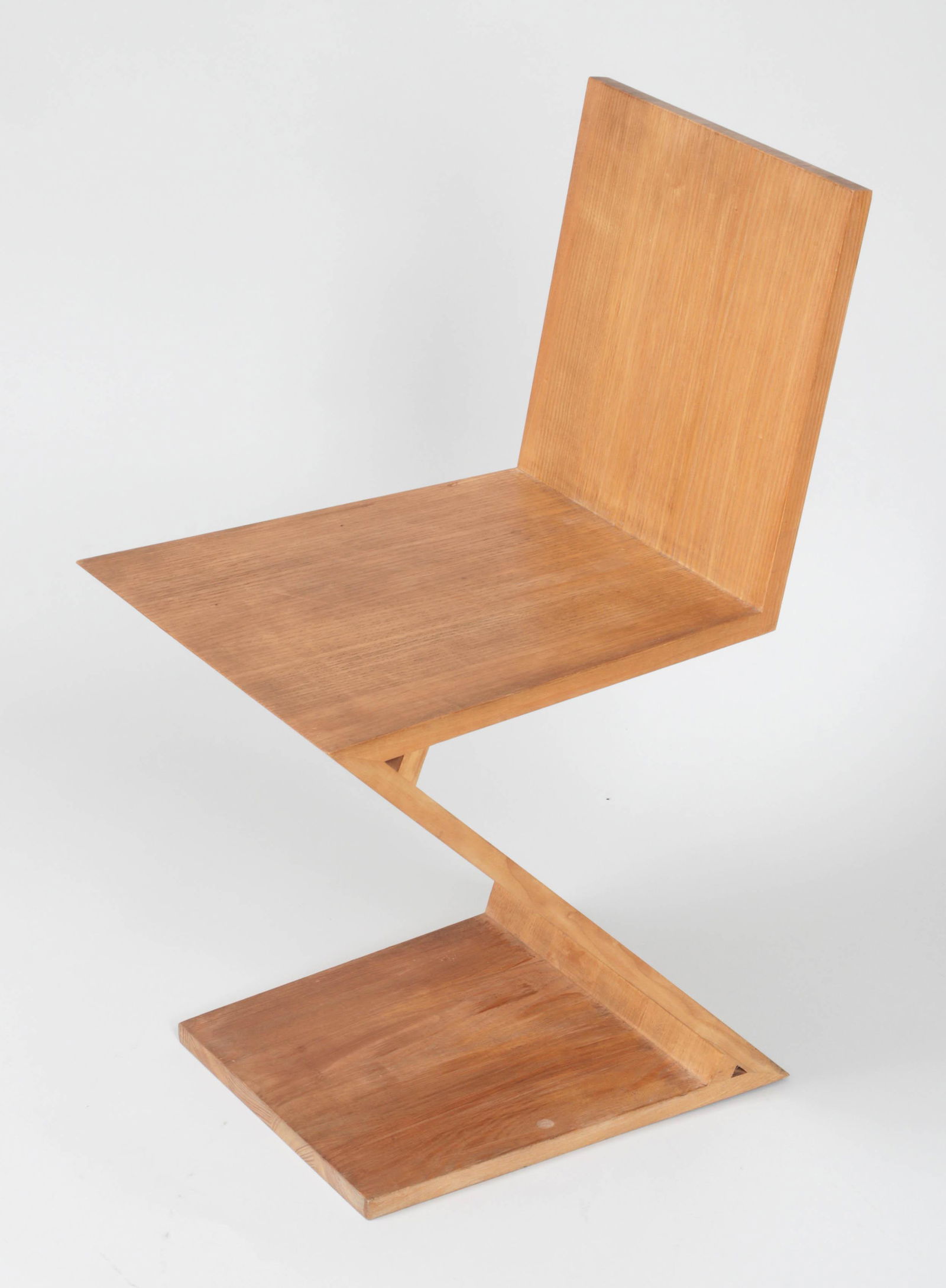 Gerrit Thomas Rietveld ''Zig-Zag'' chair: Gerrit Thomas Rietveld ''Zig-Zag'' chair, paper label. Shows wear, minor nicks. 28-3/4''h.