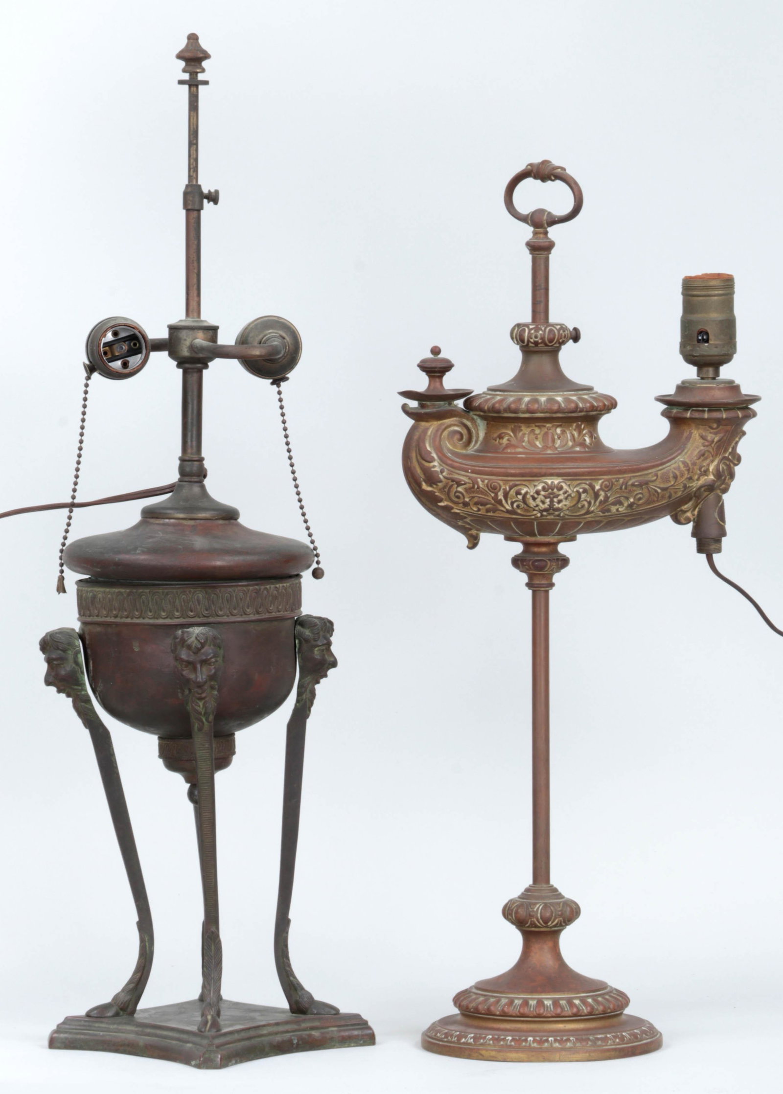 Group of (2) oil lamps: Group of (2) oil lamps, electrified, to include: brass Theodore B. Starr handled lamp, marked, (dent, lacking bottom accent); and bronze two light lamp with figural supports on four hoof feet, (suppor