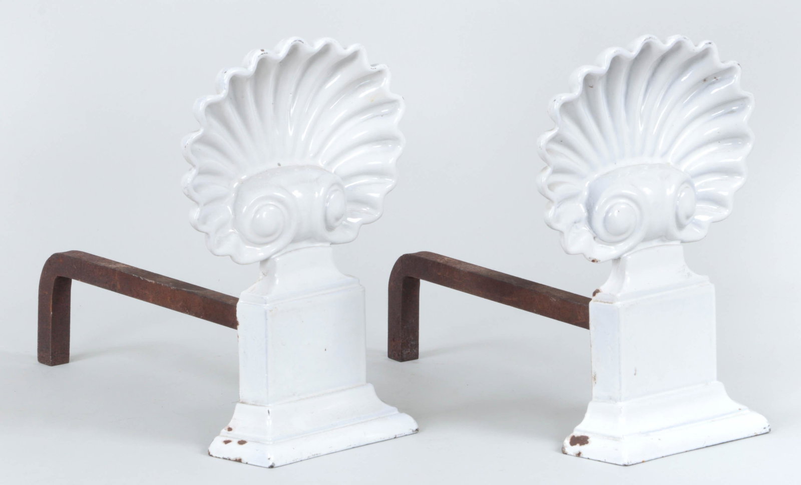 Pair of enameled shell cast iron andirons: Pair of enameled shell form cast iron andirons, marked ''Jax''. Enamel loss to both. 12-1/2''h, 8-1/2''w, 14-3/4''d.