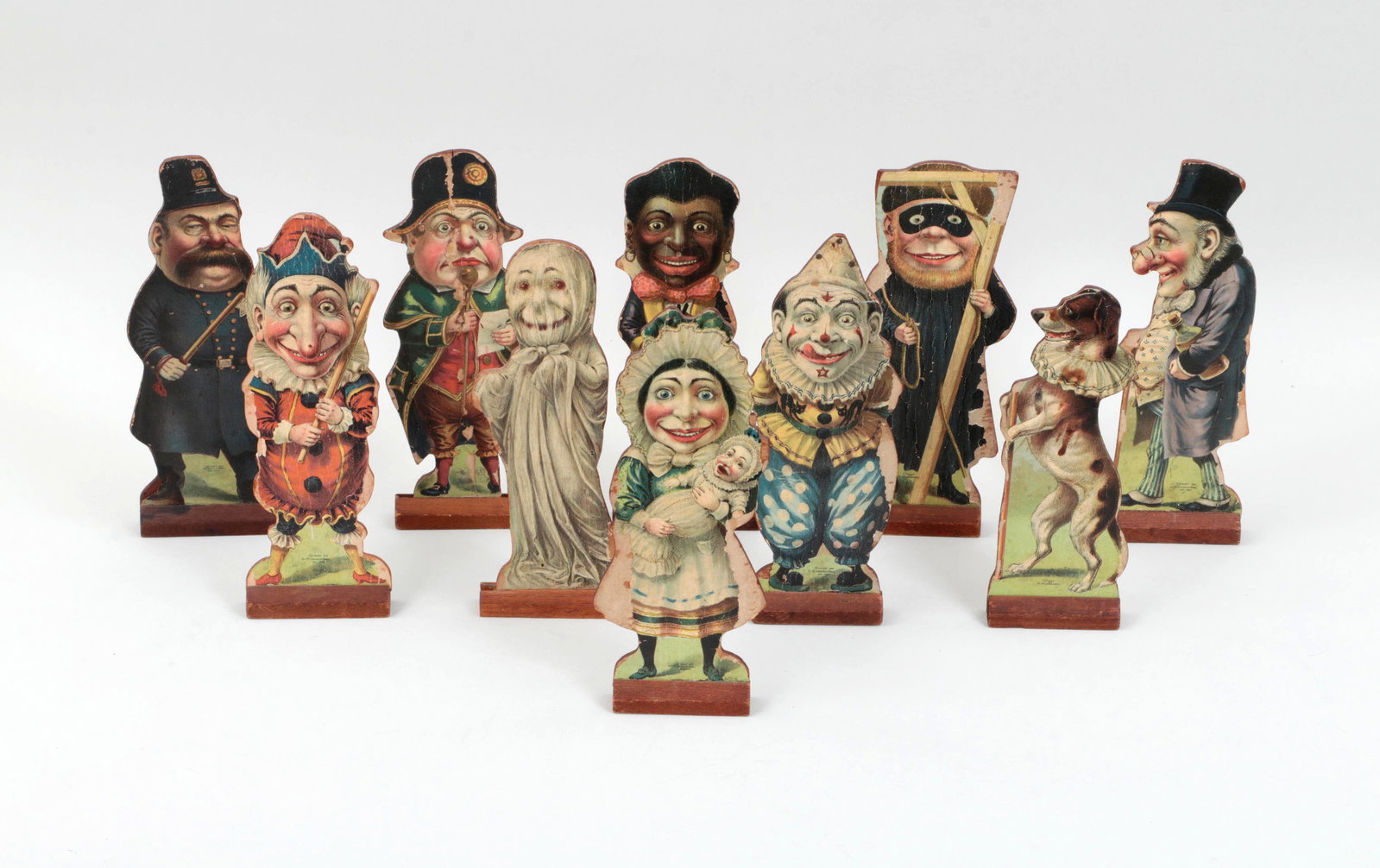 Set of (10) McLaughlin Brothers pin figures: Set of (10) McLaughlin Brothers pin figures, dated 1902, to include: Punch; Toby the Dog; Jim Crow; The Policeman; Joey the Clown; The Ghost; Judy and Baby; The Sheriff; Doctor Pills; and The Hangman.