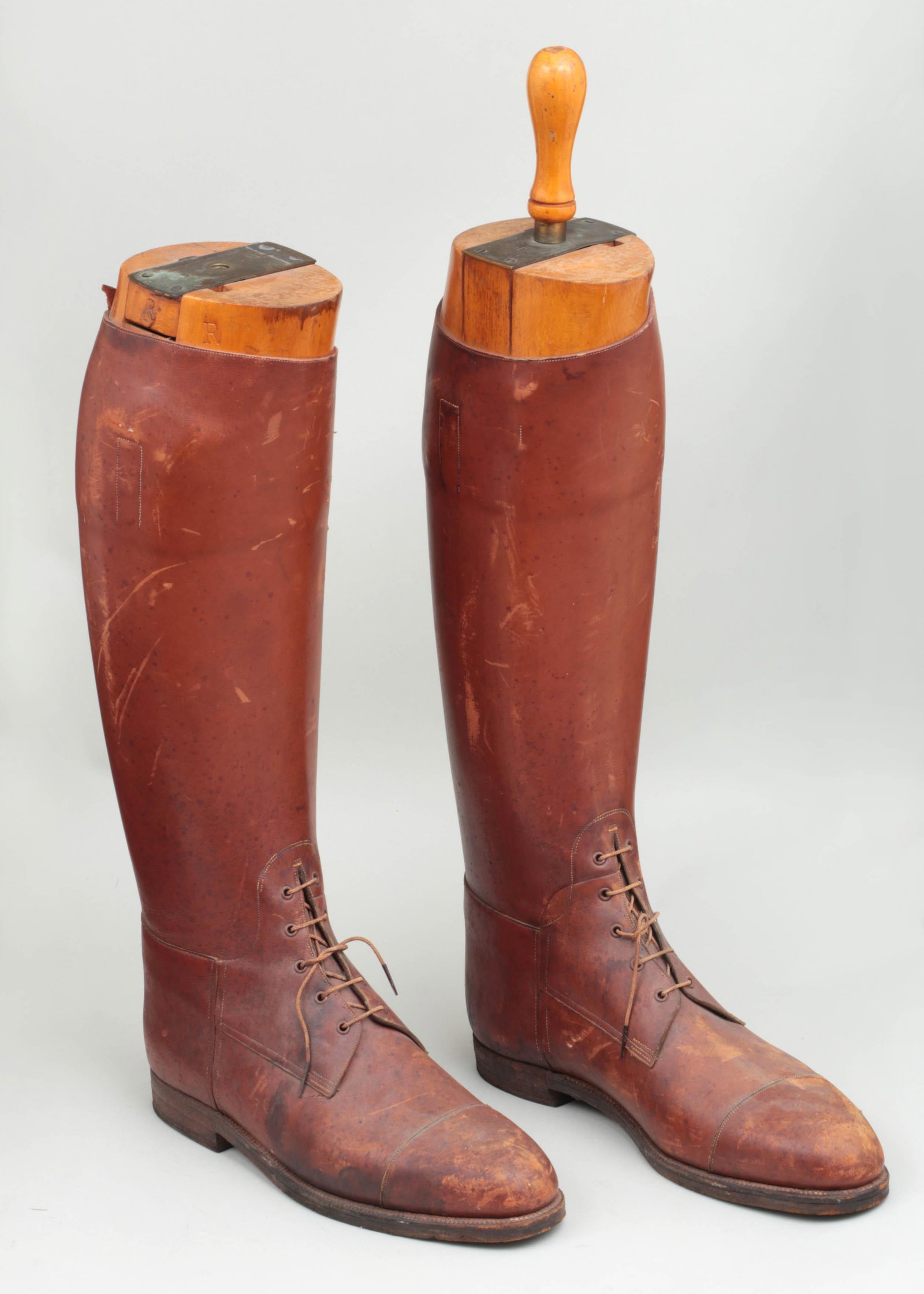 Pair of leather riding/cavalry boots: Pair of leather riding/cavalry boots, with fitted boot trees marked for ''J.W. Brooks Esq., Maxwell London'', 20th century. Wear from use, one boot tree lacking handle. Size US 17.