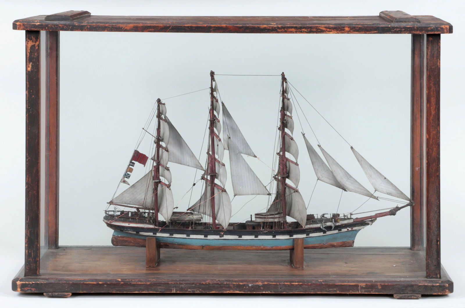 Cased ship model of ''Jane Ross,'': Cased ship model of ''Jane Ross,'' a three-masted ship with tin sails and British Red Ensign flag. Case 19-1/4''h, 30-3/4''w, 11-5/8''d.