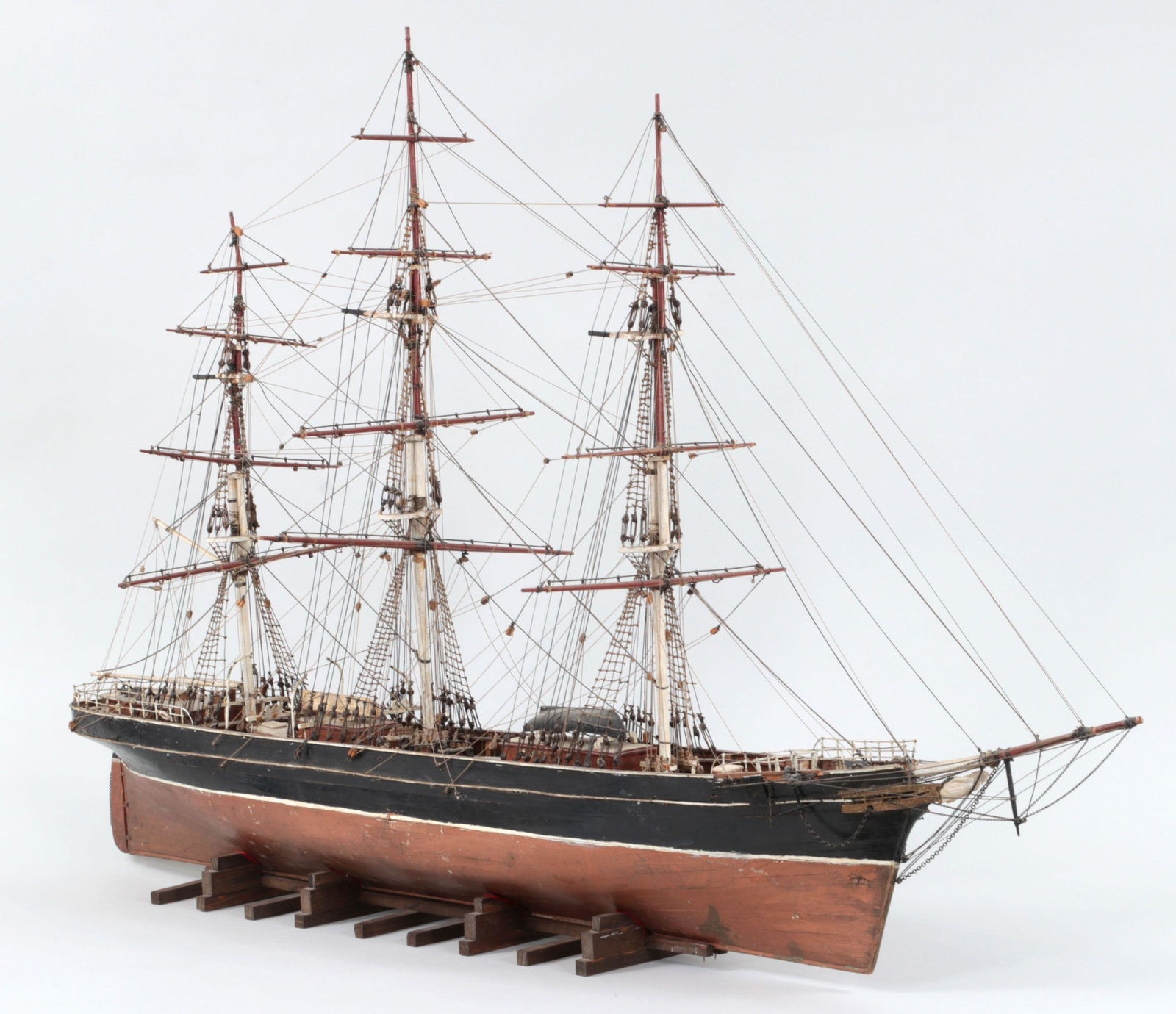 British tea clipper, Cutty Sark: Ship model of the British tea clipper, Cutty Sark. Splits to hull and broken chain on the stern. 26-3/4''h, 5-1/2''w, 42''d.