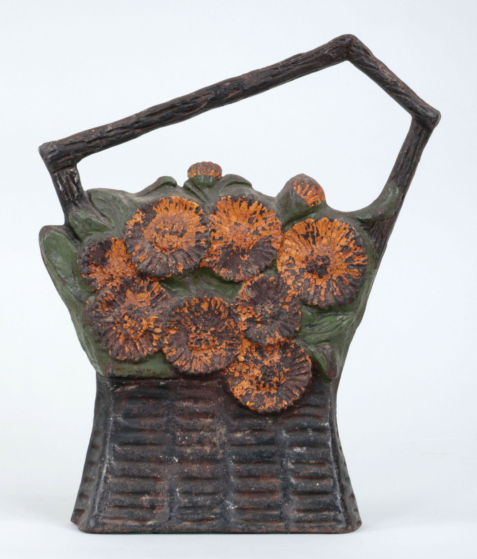Basket of flowers doorstop: Polychrome painted cast iron basket of flowers doorstop, signed ''Elsy'' and dated ''1901''. Wear to paint. 10-1/2''h, 8-3/4''w, 2-1/4''d.