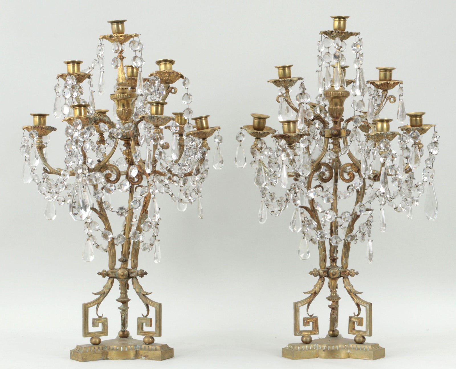 Pair of Louis XV style candelabras: Pair of elaborate ten-light Louis XV style gilt bronze and crystal candelabras. Some arms with stress cracks, needs tightening, lacking some crystal accents. 28-1/2''h.