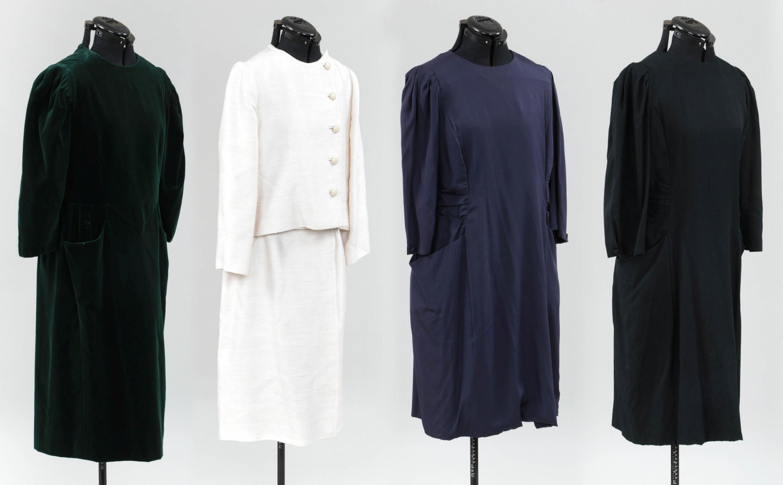 Group of (4) Sybil Connolly outfits: Group of (4) Sybil Connolly outfits, to include: black silk dress with pleated sleeves and ruched waist, bust 36'', waist 34''; navy silk dress with pleated sleeves and ruched waist, (minor pulls to f
