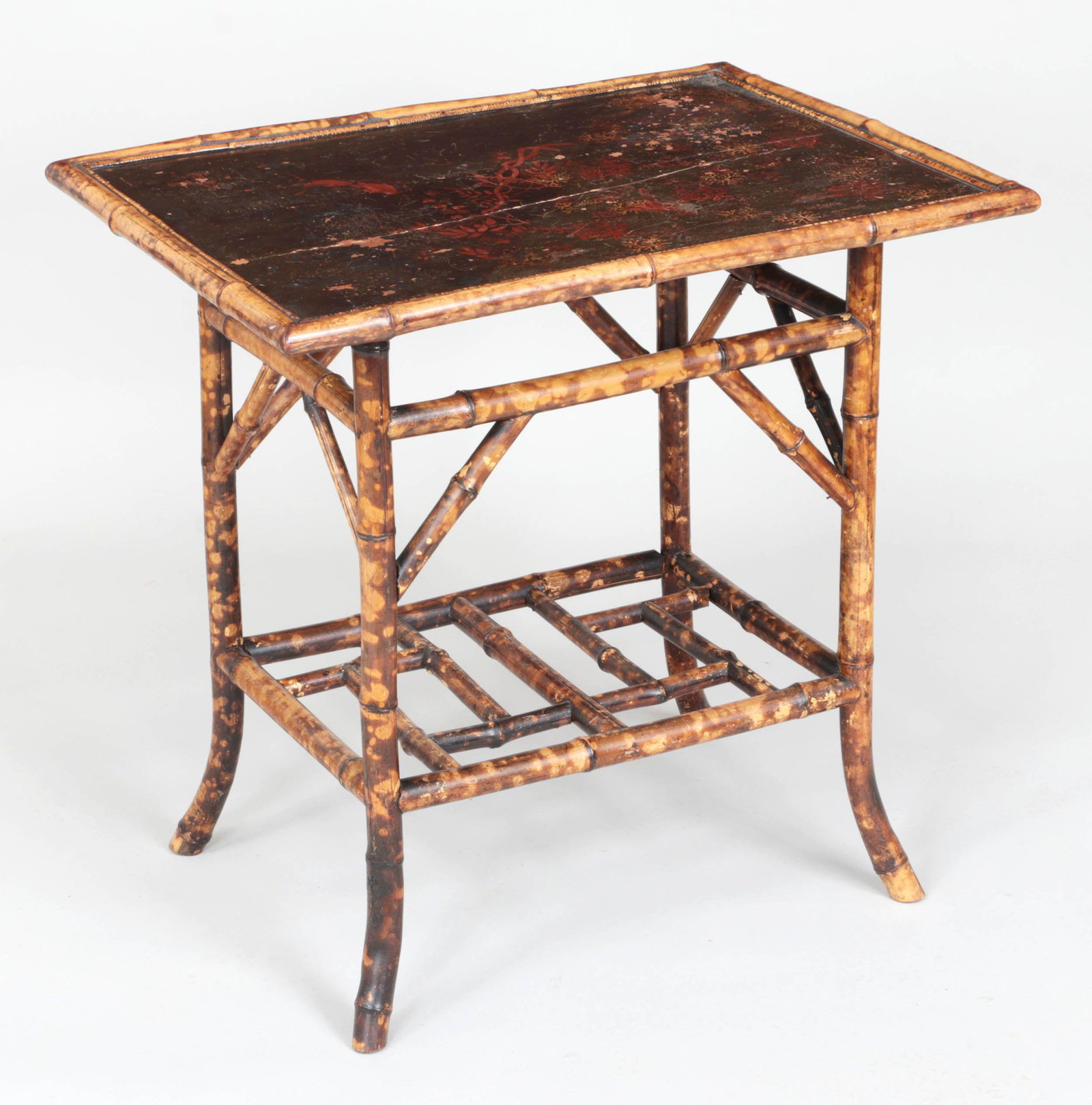 Burnt bamboo side table with japanned top: Burnt bamboo side table with japanned top. Splits to wood and losses to lacquer. 29-1/4''h, 30''w, 22-1/4''d.