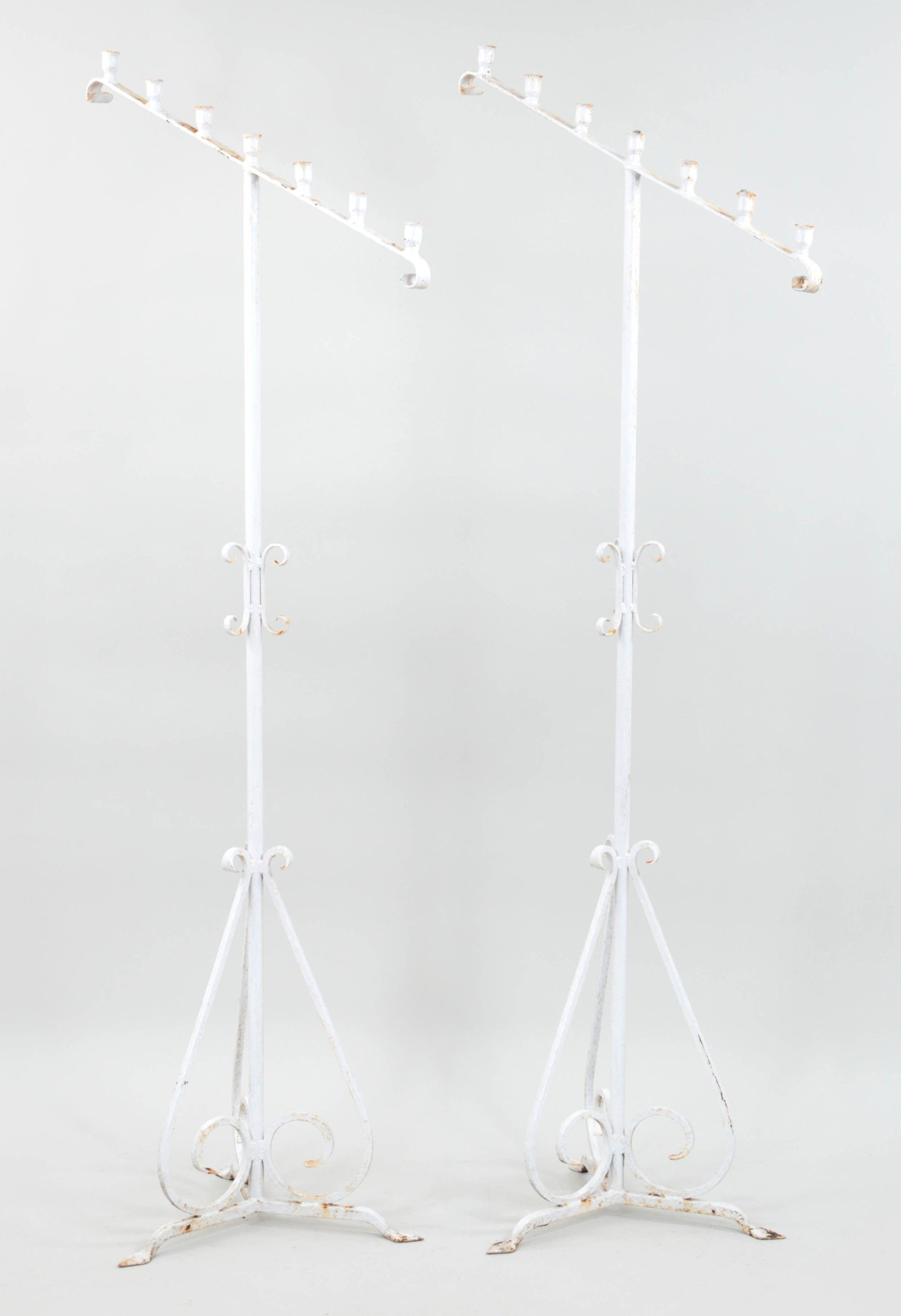 Pair of wrought iron, seven-light floor candelabra: Pair of wrought iron, seven-light floor candelabras. 76-1/4''h.