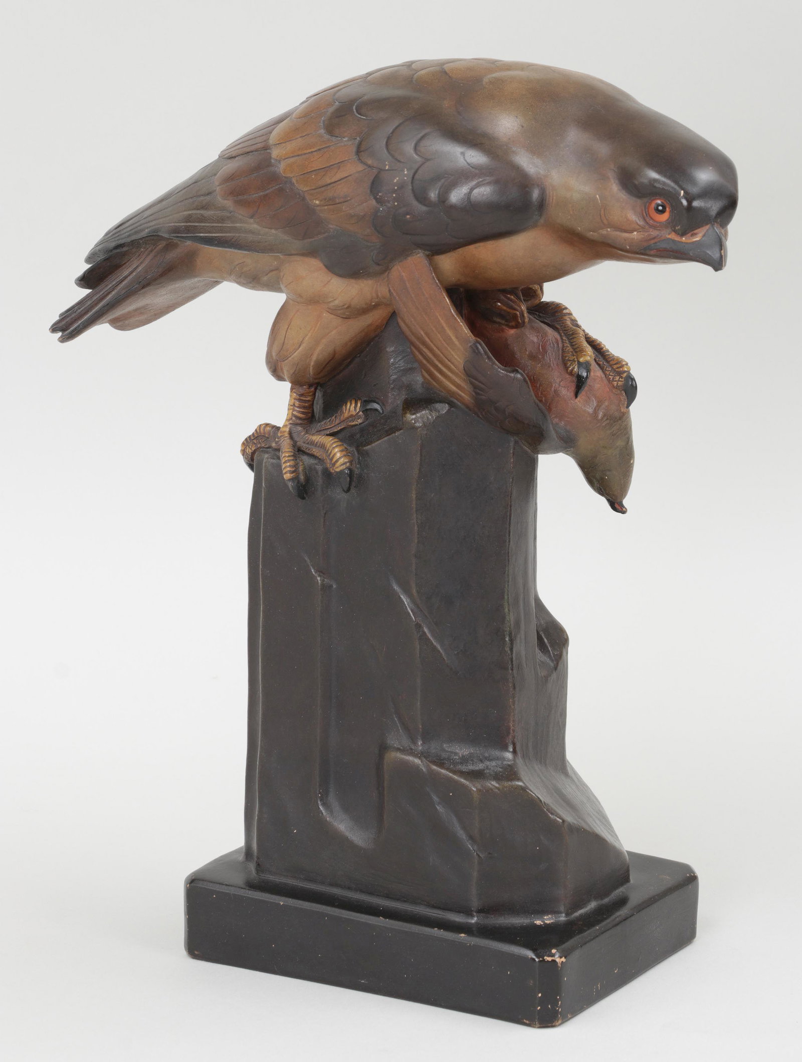 FRITZ KOCHENDORFER (German, 1871-1942): FRITZ KOCHENDORFER (German, 1871-1942), hawk with prey, glazed ceramic, marked. Minor loss and hairline to beak. 14-1/8''h, 5-1/4''w, 12-1/4''d.