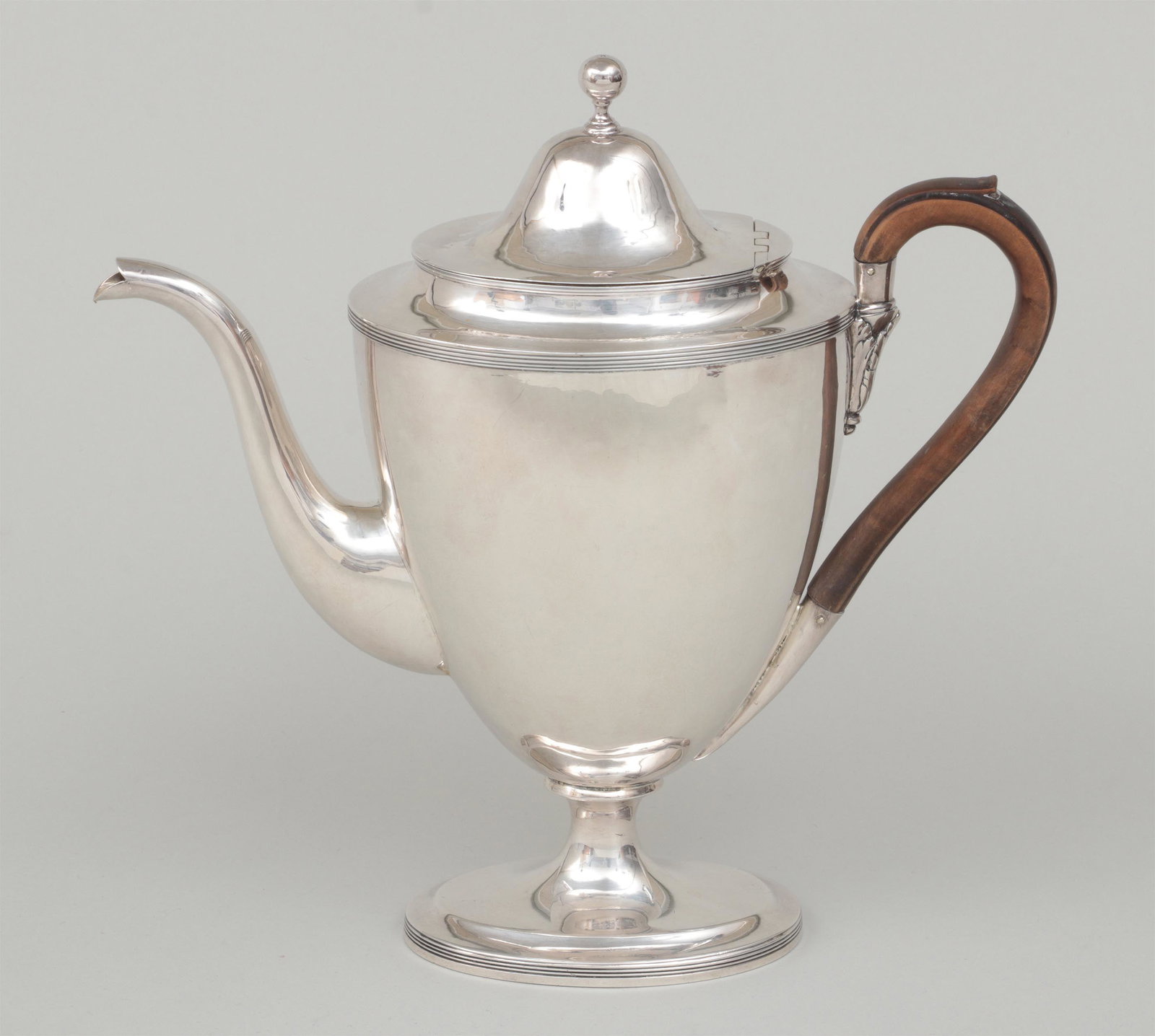 George III sterling silver coffee pot: George III sterling silver footed coffee pot with round knop and wooden handle, fully hallmarked for Henry Chawner, London, 1792. 10-1/2''h. Total approximate weight 22.5 troy oz.