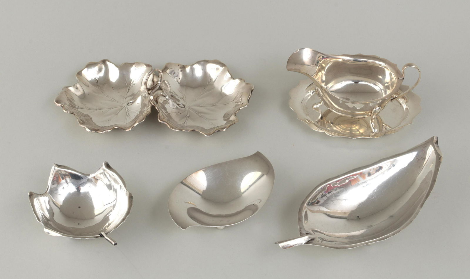 Group of (6) sterling silver table items: Group of (6) sterling silver table items, to include: Black Starr, Sciarrotta & Gorham leaf-form bowl with naturalistic rim and veins, on three ball feet; Sciarrotta leaf-form dish on three ball feet;