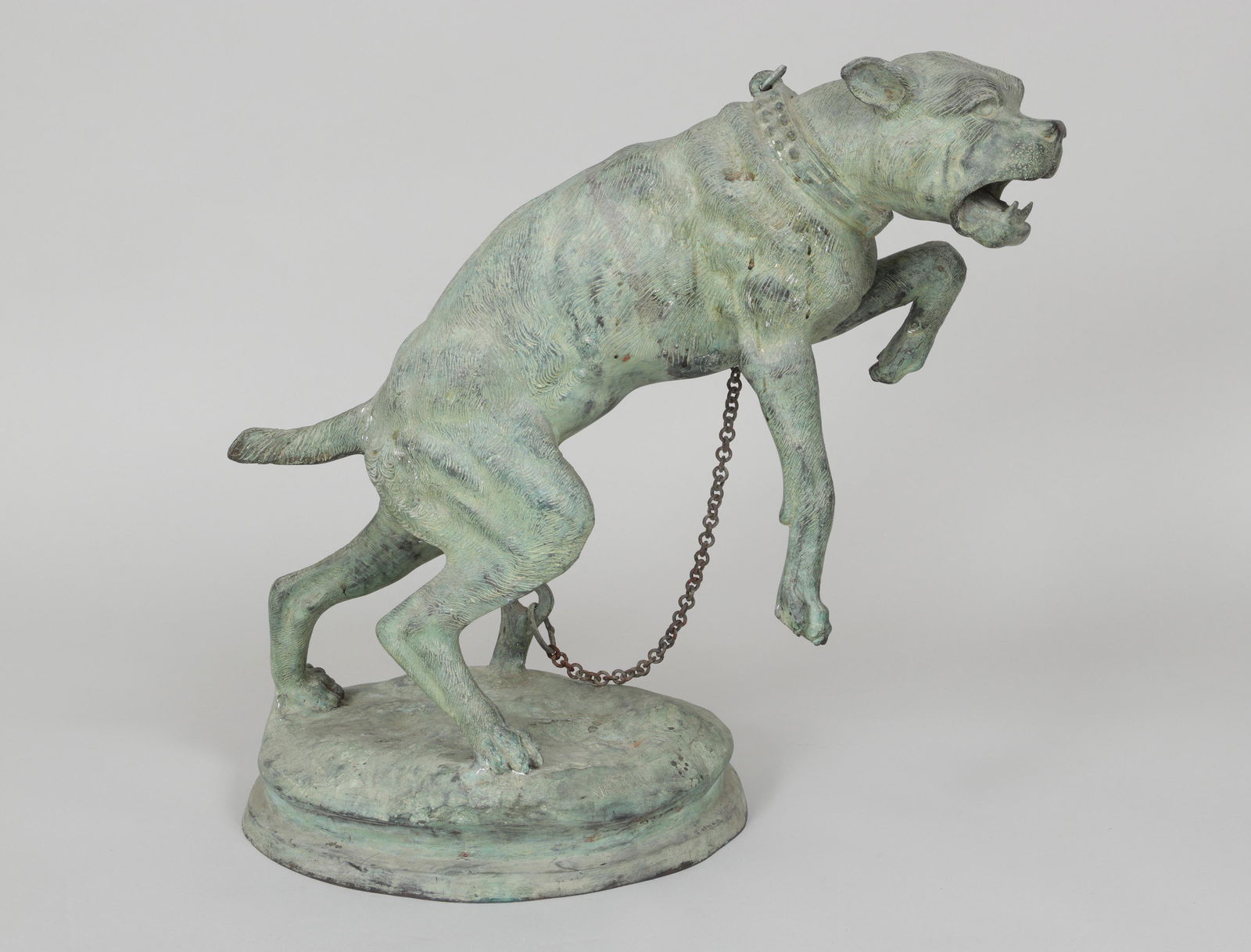 After CHARLES VALTON (French, 1851-1918): After CHARLES VALTON (French, 1851-1918), chained, lunging dog garden ornament, verdigris bronze, signed. Mild oxidation to chain. 23''h.