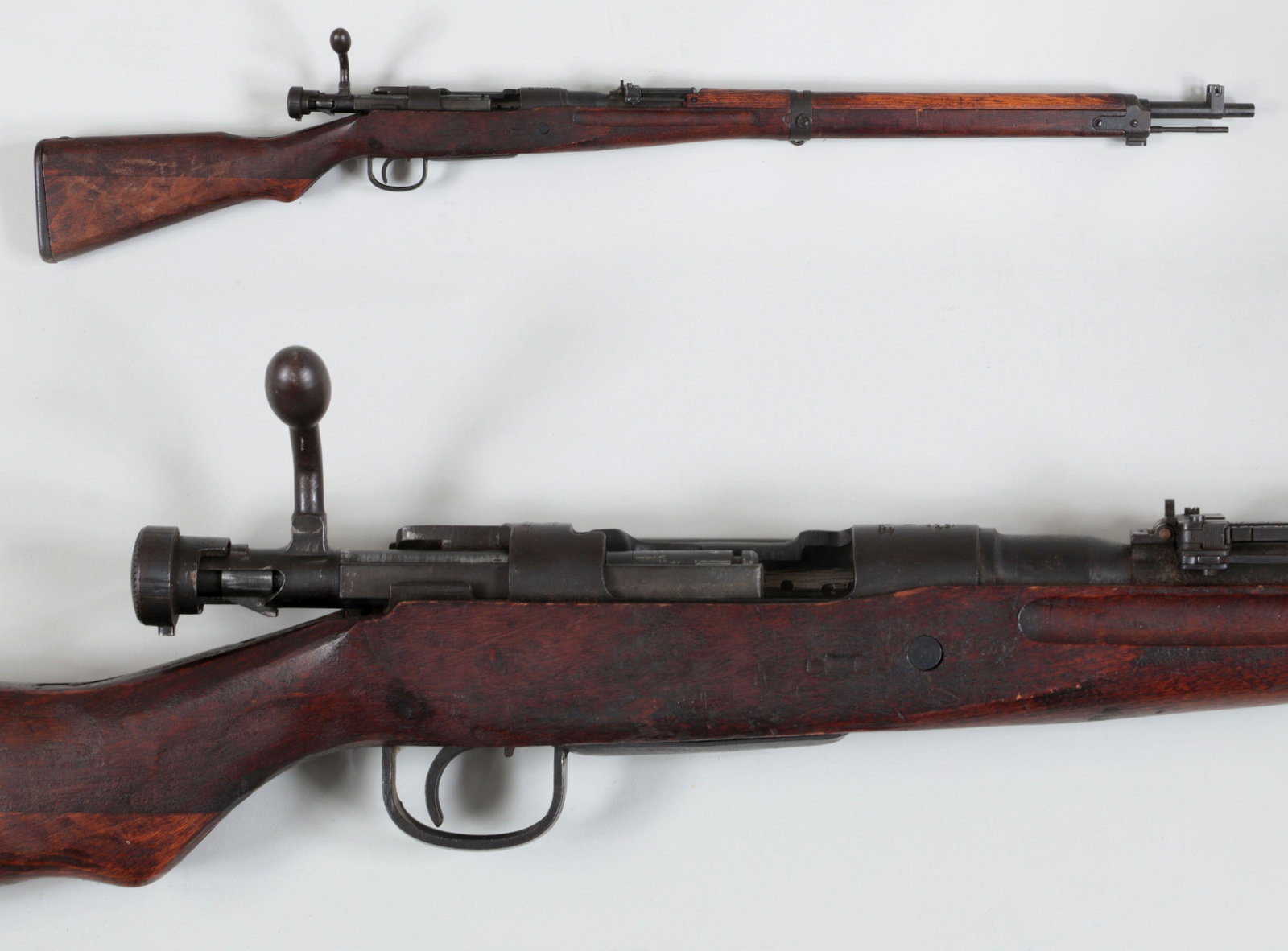 Arisaka Type 99 Sniper Rifle: Arisaka Type 99 Sniper Rifle in 7.7mm. The barrel measures 25'' with aircraft sights and scope mount (no scope). The bolt is correctly bent for a Sniper rifle and the serial number is on the receiver 