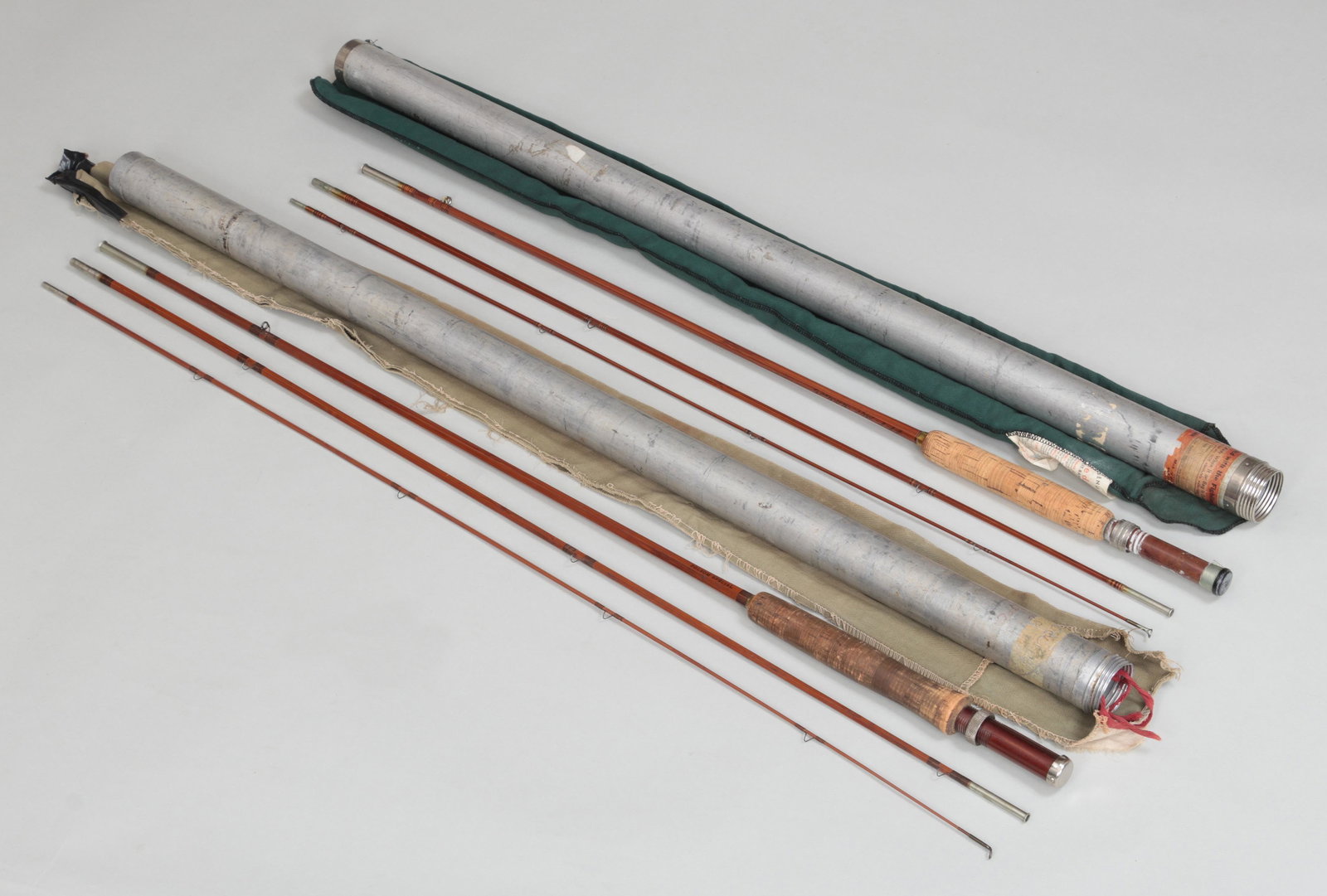 Group of (2) fly rods: Group of (2) fly rods, to include: Heddon #8 8' 3-piece 2-tip 4 oz. For an HDH line. The down-locking reel seat has a Bakelite filler and black butt cap. Ring stripper guide with snake guides with bro