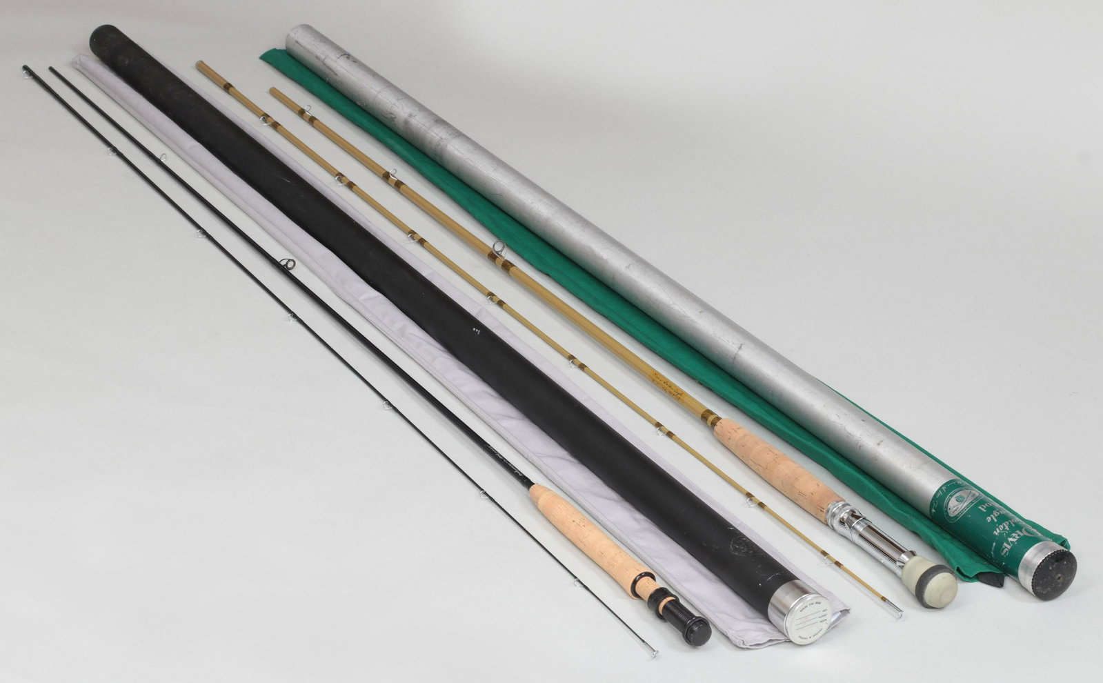 Group of (2) fly rods: Group of (2) fly rods, to include: T&T Model LPS 905 9' 2-piece, 1-tip #5 graphite rod, as new in original bag and tube; and Orvis Golden Eagle glass rod 8' 9'' 2-piece, 1-tip 7oz. for a WF11F line. S