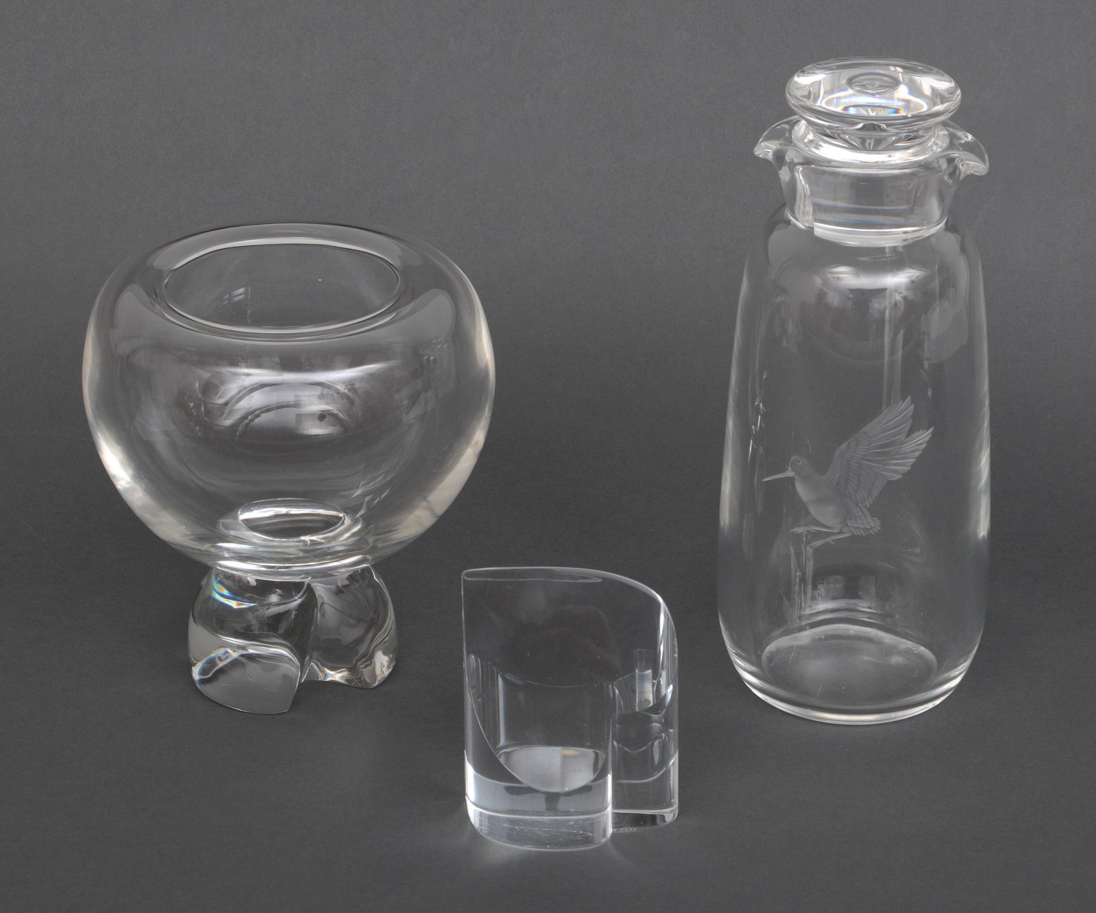 Elsa Peretti for Tiffany & Stueben: Group of (3) glass items, to include: Elsa Peretti for Tiffany vase; Stueben heart shaped paperweight; and Stueben cocktail shaker with etched bird. All signed. Chip and nicks to paperweight. Largest 