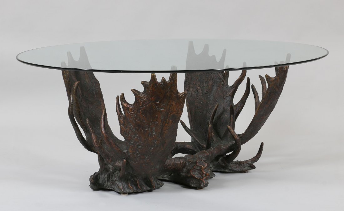 DICK IDOL: DICK IDOL (American, 20th/21st century), cast resin antler and glass top coffee table, 2002, signed and dated on base. Scratches to glass top, repair to resin base. 19-1/2''h, 48-1/2''l, 37''w.