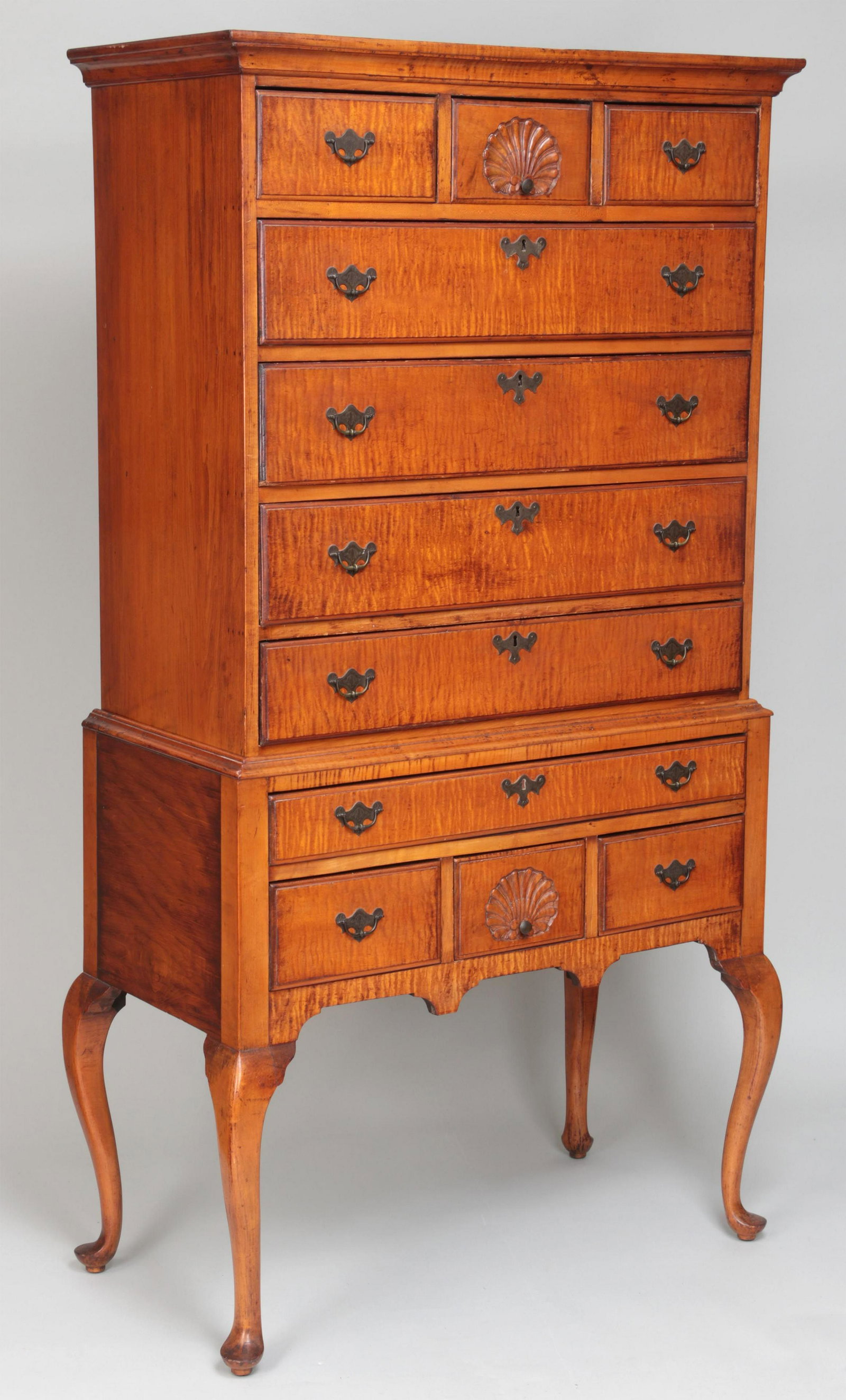 Queen Anne tiger maple highboy: 18th century American tiger maple country Queen Anne high boy with shell carved drawers. Some restorations, repairs, and replacements. 71''h, 39''w, 20-1/2''d.