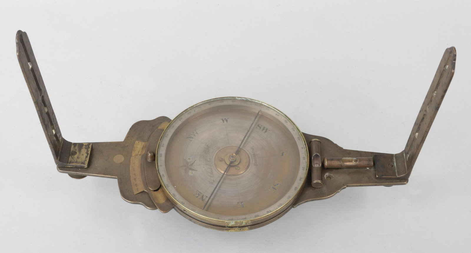 William Clark & Son vernier compass: Mid-19th century William Clark & Son brass vernier compass, marked ''Wm. Clark & Son Philada., Warranted'' on the silvered dial. Lacking dial cover. Dial 6''dia., 13-3/4''l. Provenance: Estate of Will