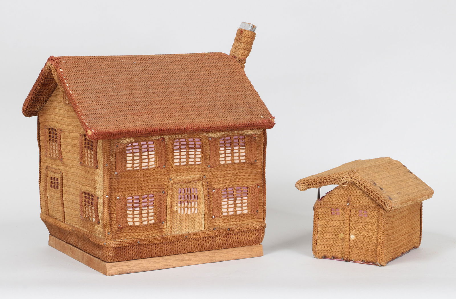 Sailor-made knotted houses: Group of (2) 19th/20th century sailor-made knotted houses, tacked to boards. Discoloration, loose chimney, losses. Largest: 15''h, 14''w, 13''d. Provenance: Estate of William Kranker, collector and de