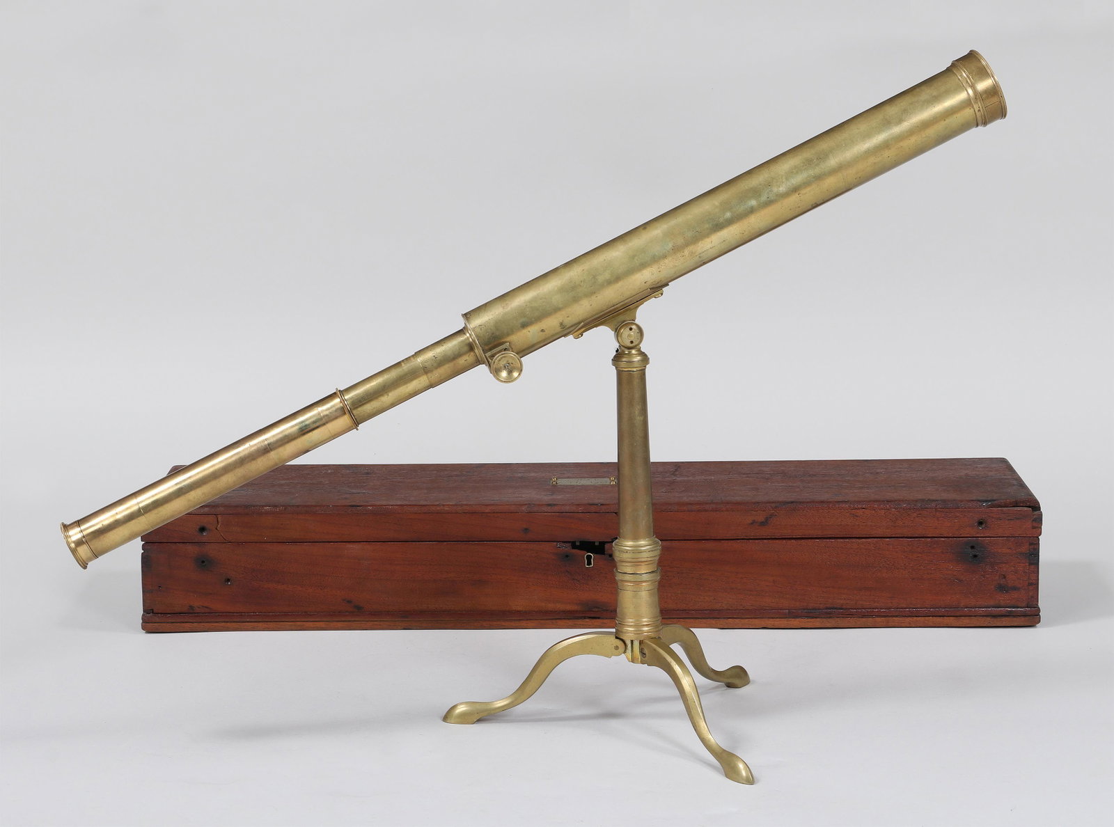 Late-18th century Ramsden telescope: Late-18th century Ramsden brass library telescope with rack and pinion focusing, marked ''Ramsden, London'' on barrel, with celestial and terrestrial eye pieces, set on a tripod base, in wood case wit