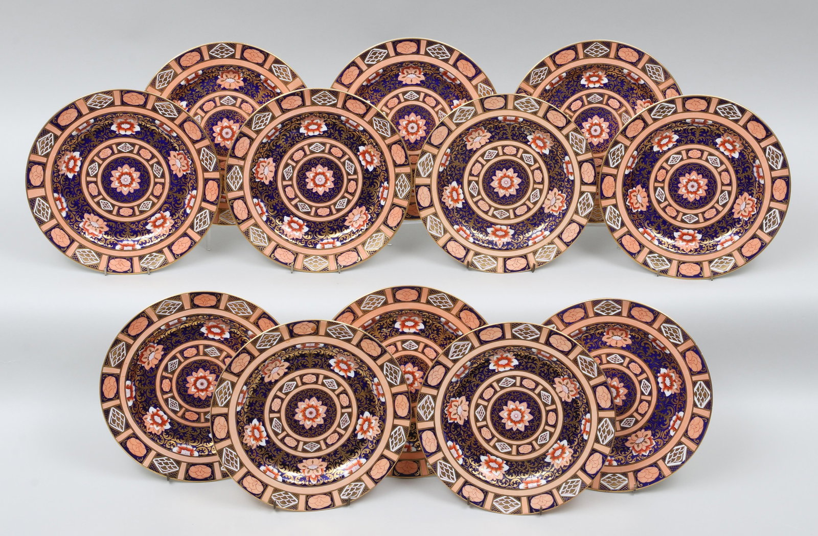 Set of (12) 19th century Mason's plates: Set of (12) 19th century Mason's Ironstone plates, in the Imari pattern. Crazing, one with early staple repair. 10-1/2''dia.