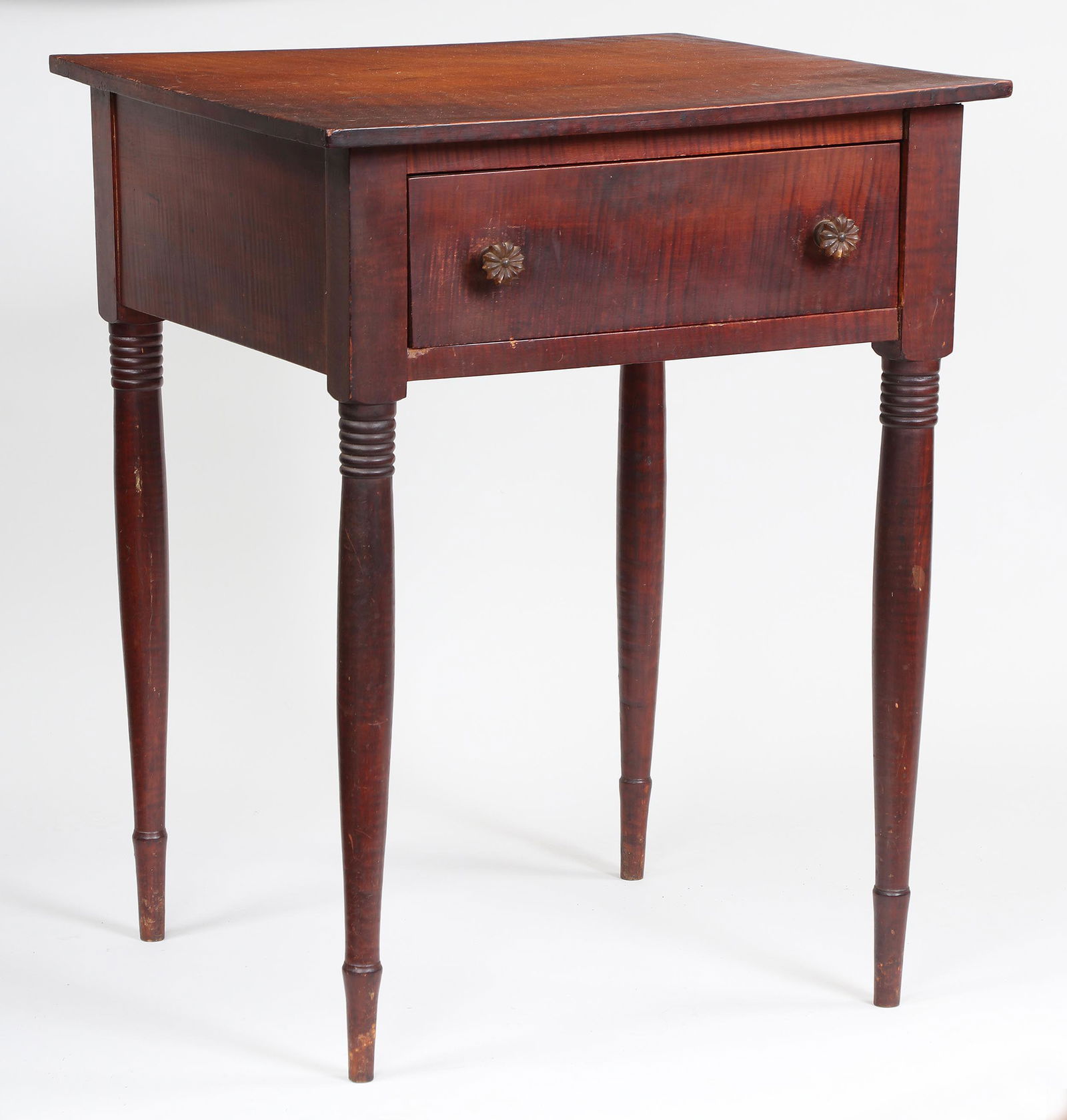 American Tiger Maple stand: American tiger maple stand with single drawer, on turned tapering legs. Wear from use. 29-1/4''h, 22-3/4''w, 22-1/2''d. Provenance: Estate of William Kranker, collector and dealer, Greenport, NY.