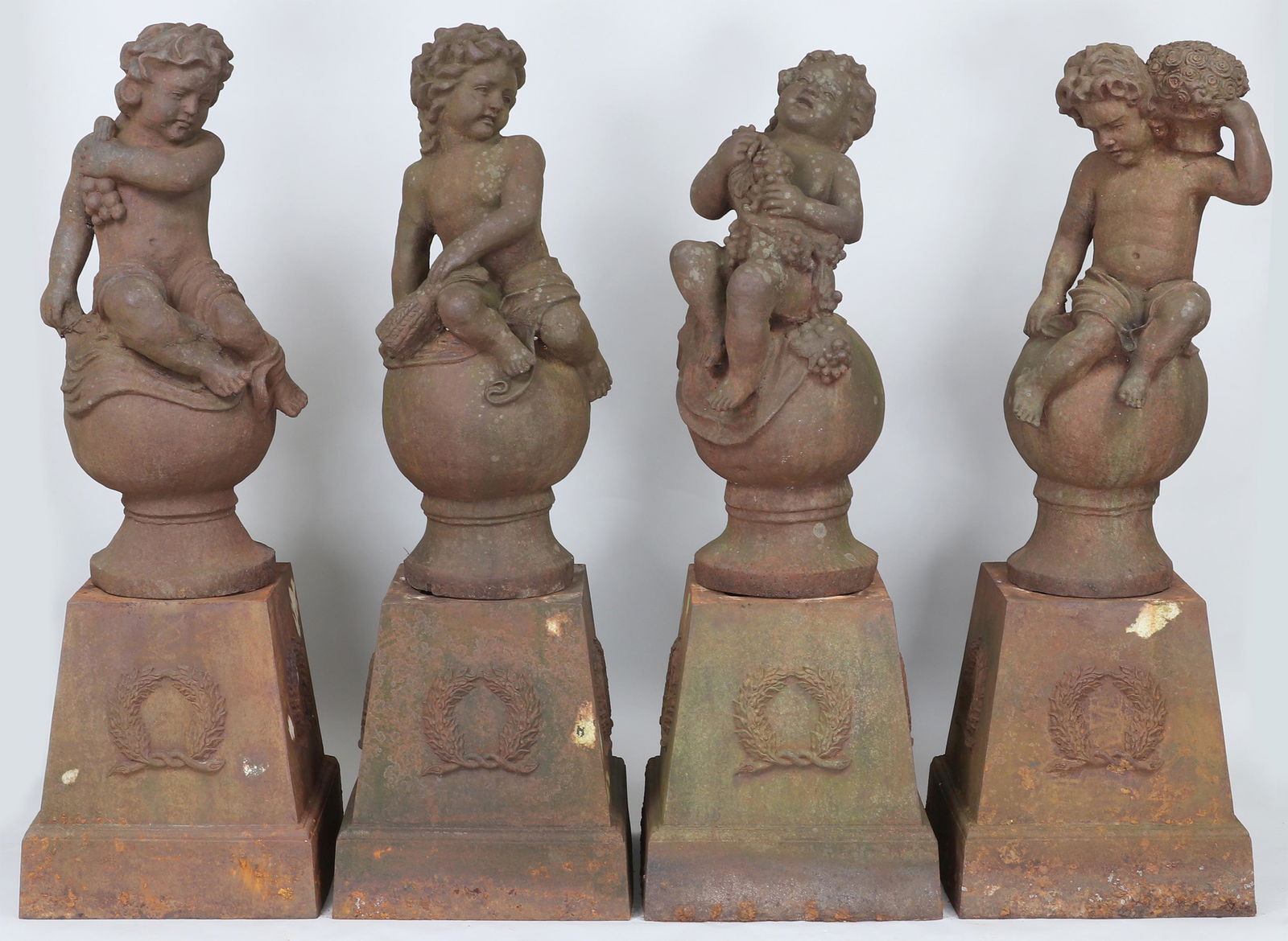 Set of (4) cast iron ''Four Seasons'' (1 of 12)