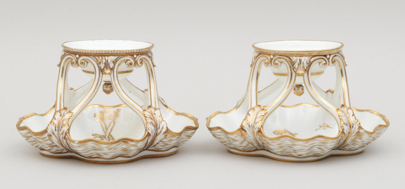 Pair of Duc d'Angouleme: Pair of Duc d'Angoulame, Paris Porcelain tiered serving compotes, having scrolled supports with acanthus leaf designs and gilt detailing, one depicting garden vegetables, and the other with fish and s
