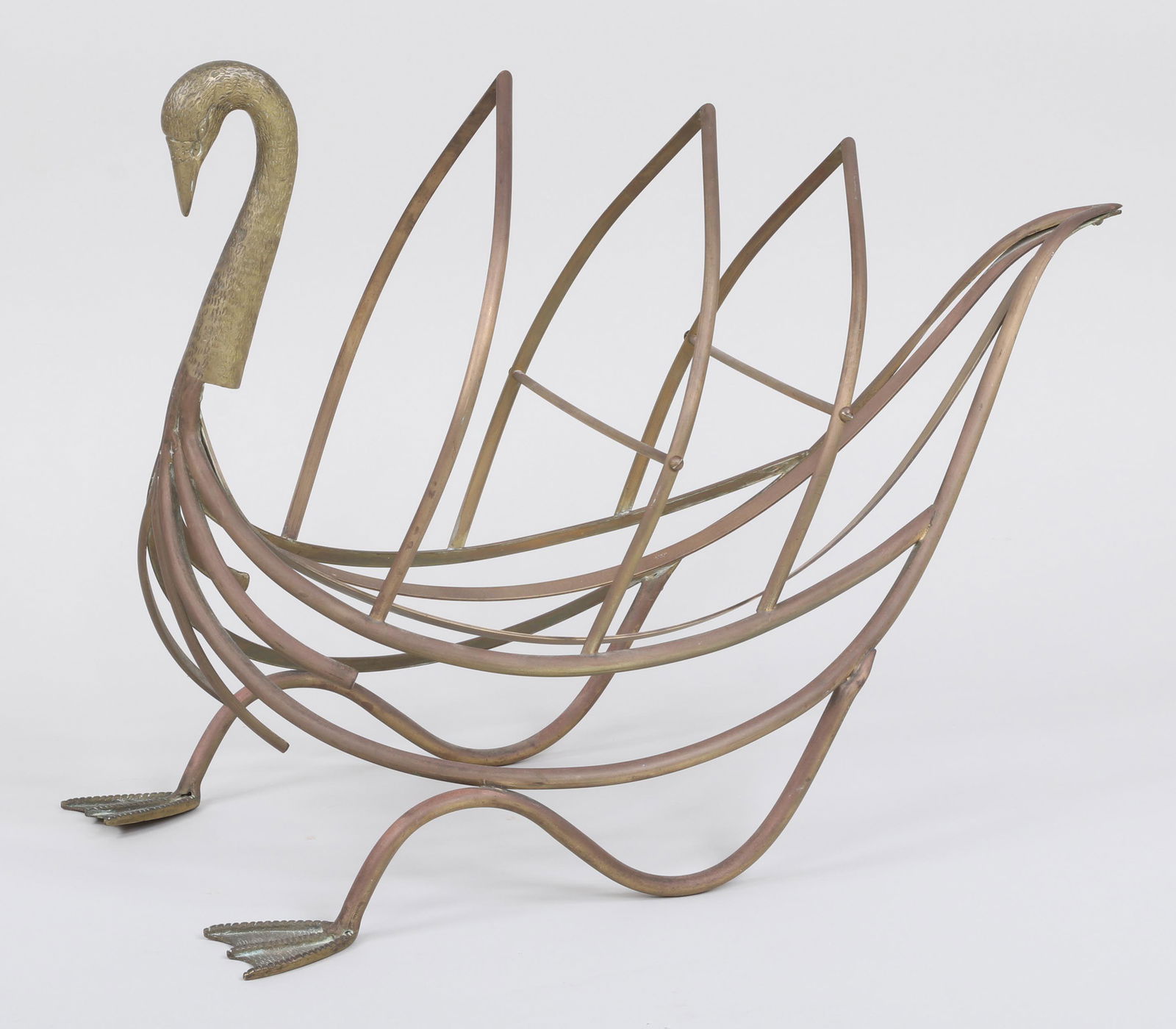Maison Jansen swan magazine rack: Brass and bronze Maison Jansen swan-form magazine rack. Minor casting imperfections. 18-1/2''h, 12-1/4''w, 26''d