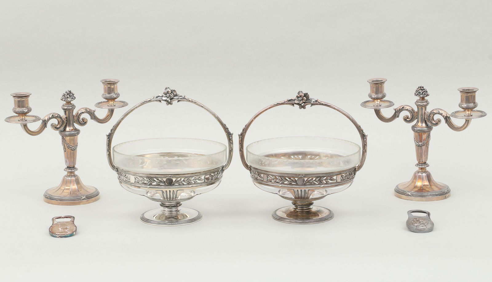 Christofle/O.Gallia silver-plated four-piece set: Christofle/O.Gallia silver-plated four-piece set, to include: pair of O.Gallia baskets, having flower decorated handles and pierced body with leaves, and original cut glass inserts, marked (loss of si