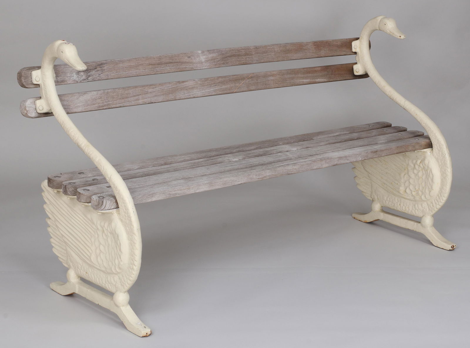 Cast iron swan garden bench: Cast iron swan garden bench with wood slat seat and back, 19th/20th century. 34''h, 63''w, 23-1/4''d.