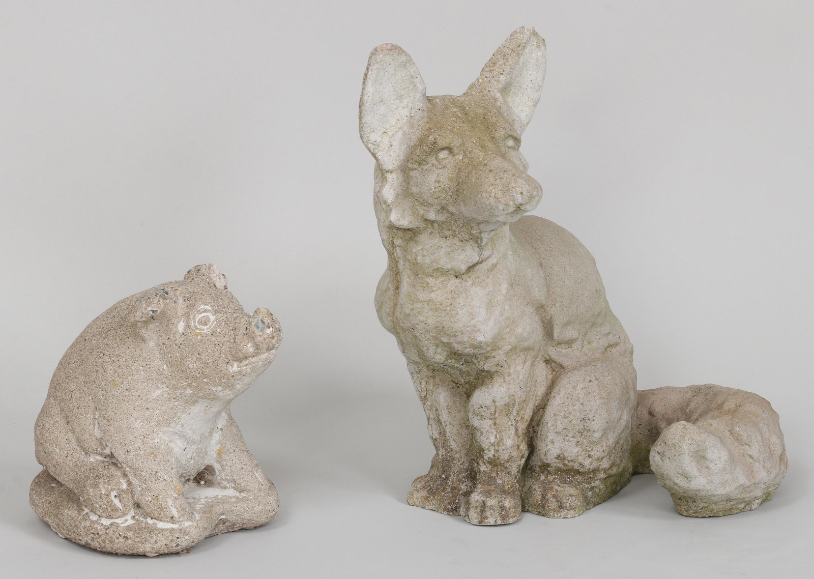 Group (2) cast stone garden sculptures: Group (2) cast stone garden sculptures, fox and piglet. Minor loss to ears. Fox 14-1/4''h.