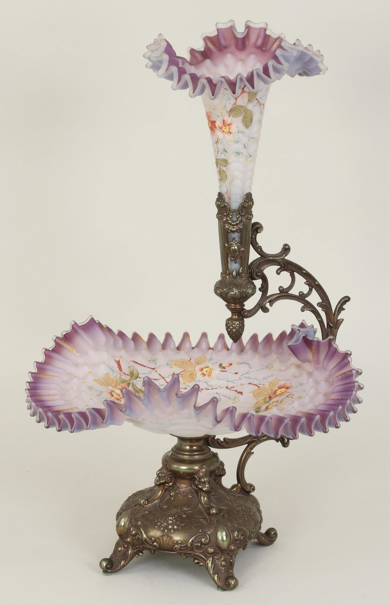 Bohemian glass epergne: Bohemian glass epergne with ruffle edge and floral enamel paint decoration, having two tiers with a trumpet form vase on scrolled arm support over compote, raised on a Rococo-style gilt bronze base en