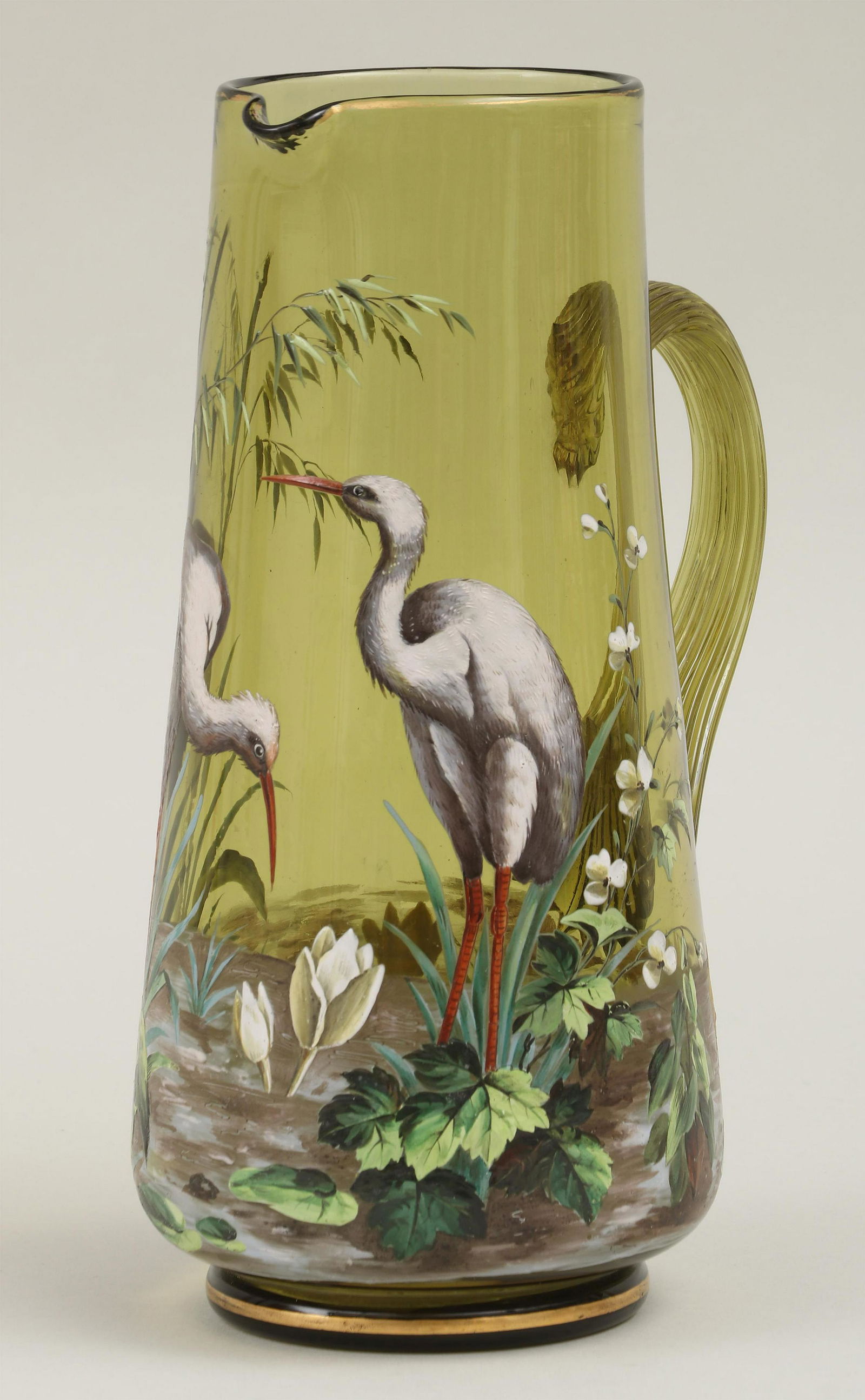 Moser enamel painted art glass pitcher: Moser enamel painted art glass pitcher with scenes depicting cranes. Minor wear from use, gilt loss at rim. 10-1/2''h.