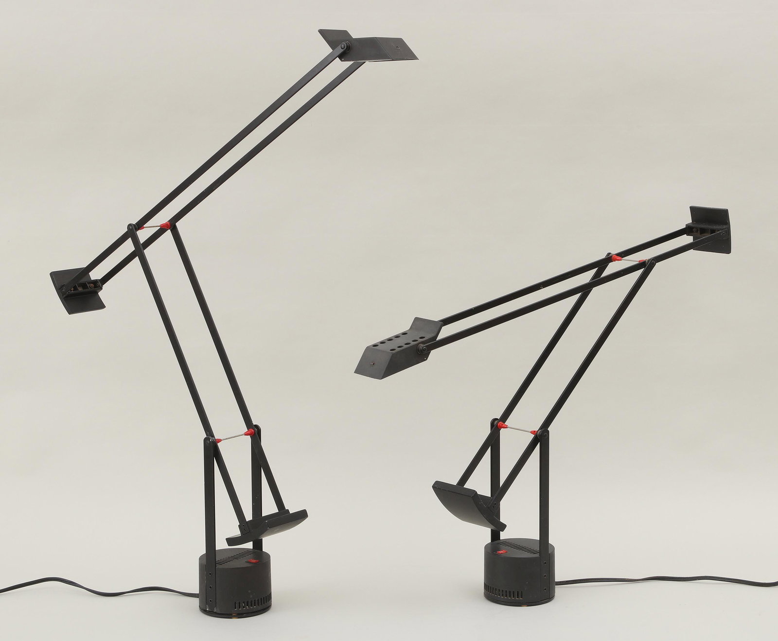 Pair Tizio desk lights: Pair Tizio desk lights, designed by Richard Sapper for Artemide, marked on bottom, in black. Wear from use, need cleaning. 44-1/2''h (fully extended).