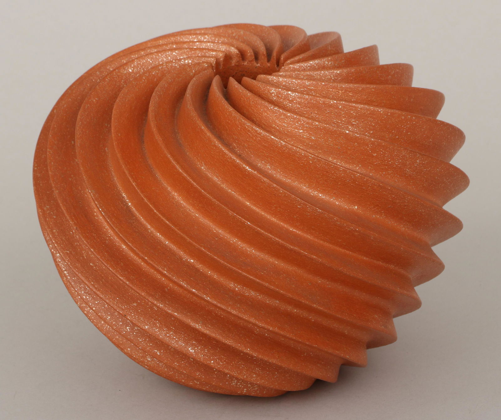 HUBERT CANDELARIO (San Felipe Pueblo, b. 1965): HUBERT CANDELARIO (San Felipe Pueblo, b. 1965), swirl melon jar, 1994, micaceous redware, signed, dated and inscribed ''San Felipe'' to bottom. Dirt in crevices. 5-1/4''h, 7''dia.