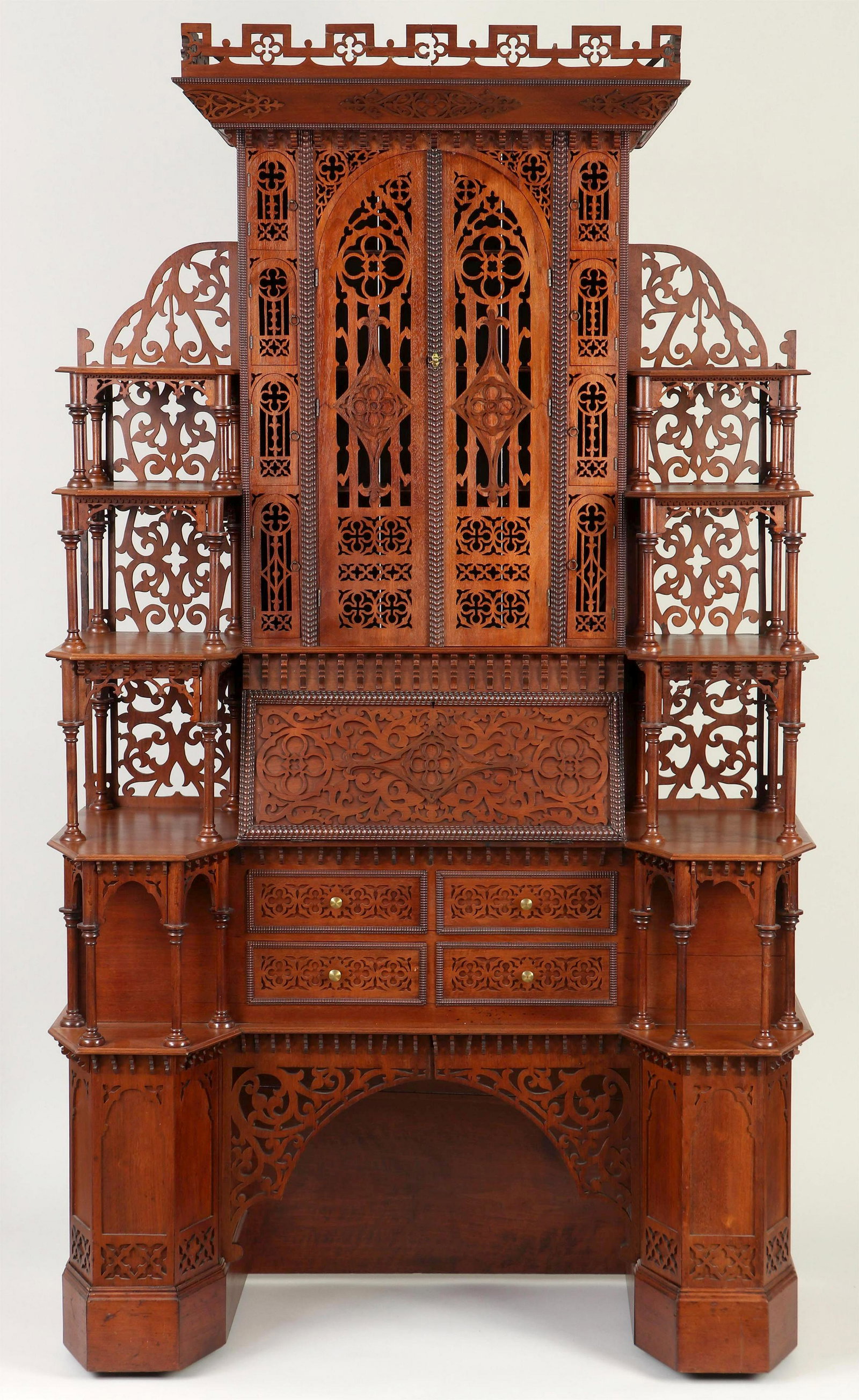 Gothic-style Tramp Art secretary desk: Gothic-style Tramp Art secretary desk, having pierced gallery top, above central arched double doors flanked by eight small arched doors, all with open fretwork, dropfront writing surface with fitted 