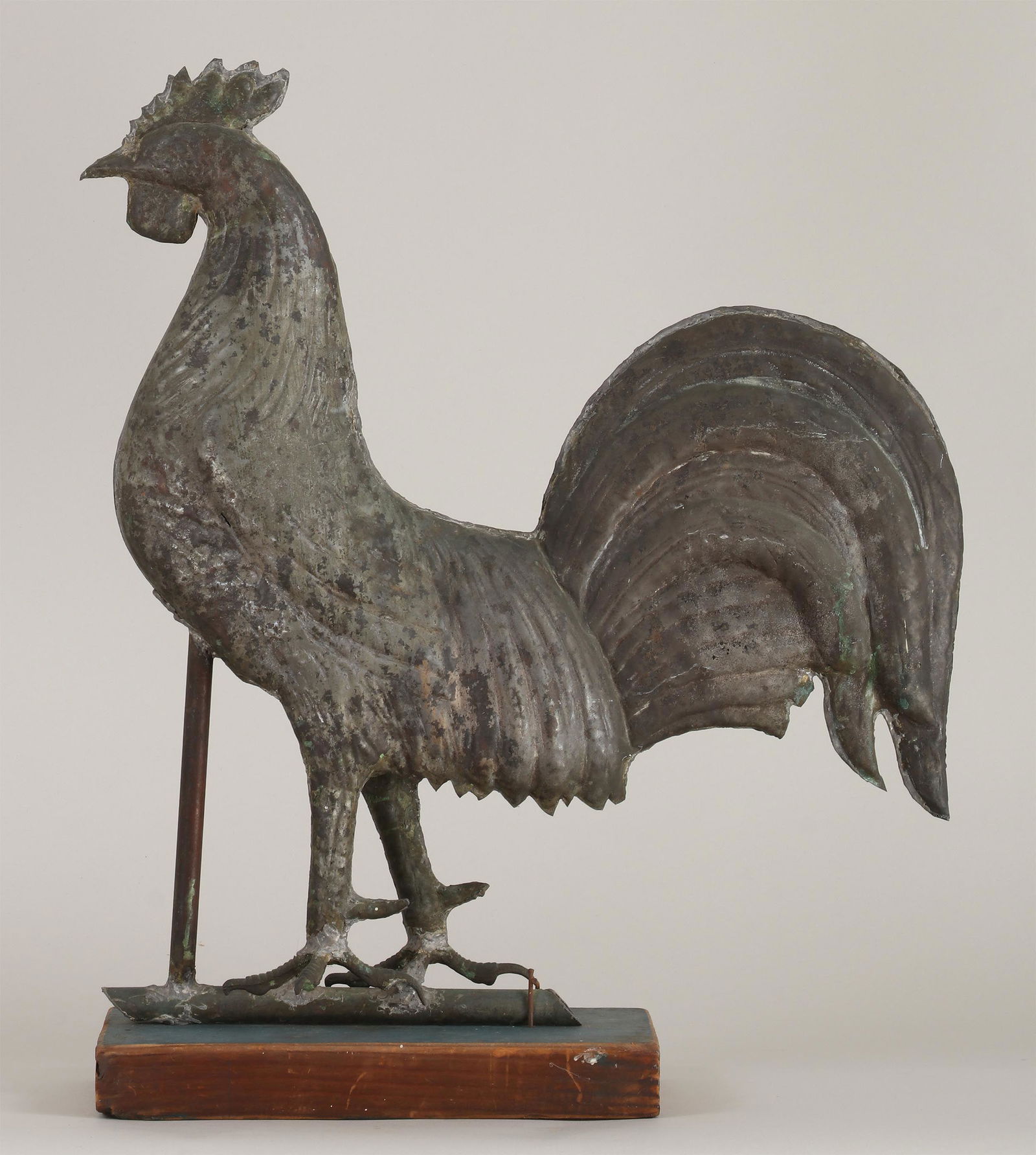 Full-bodied copper rooster weathervane: Full-bodied copper rooster weathervane, mounted to wood base. Repairs. 23''h, 19''w, 5-1/2''d (including wood).