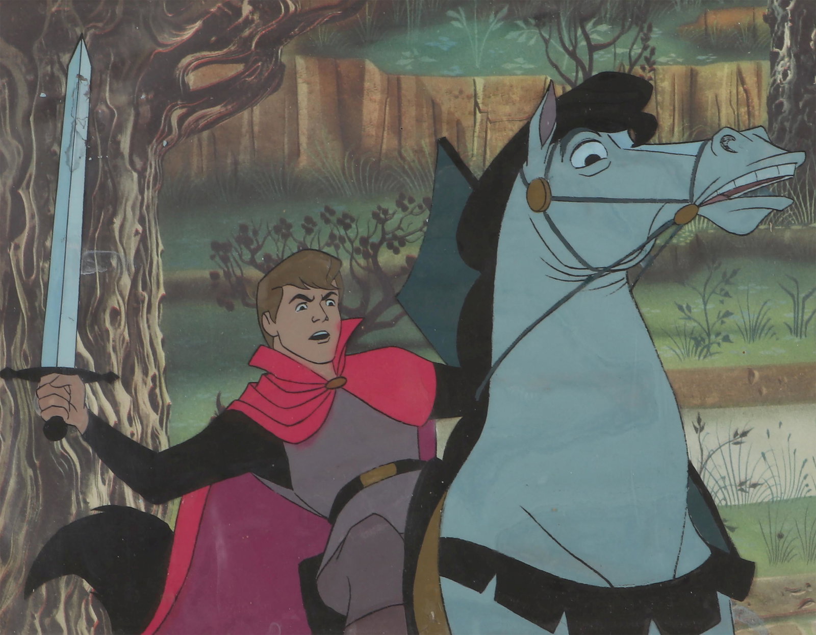 Sleeping Beauty, 1959: WALT DISNEY STUDIOS (American, est.1923), Prince Philip production cel from ''Sleeping Beauty'', 1959. Some paint crackle and lifting. Image 8-1/2''h, 9-1/2''w; backdrop 9-1/4''h, 11-1/2''w.